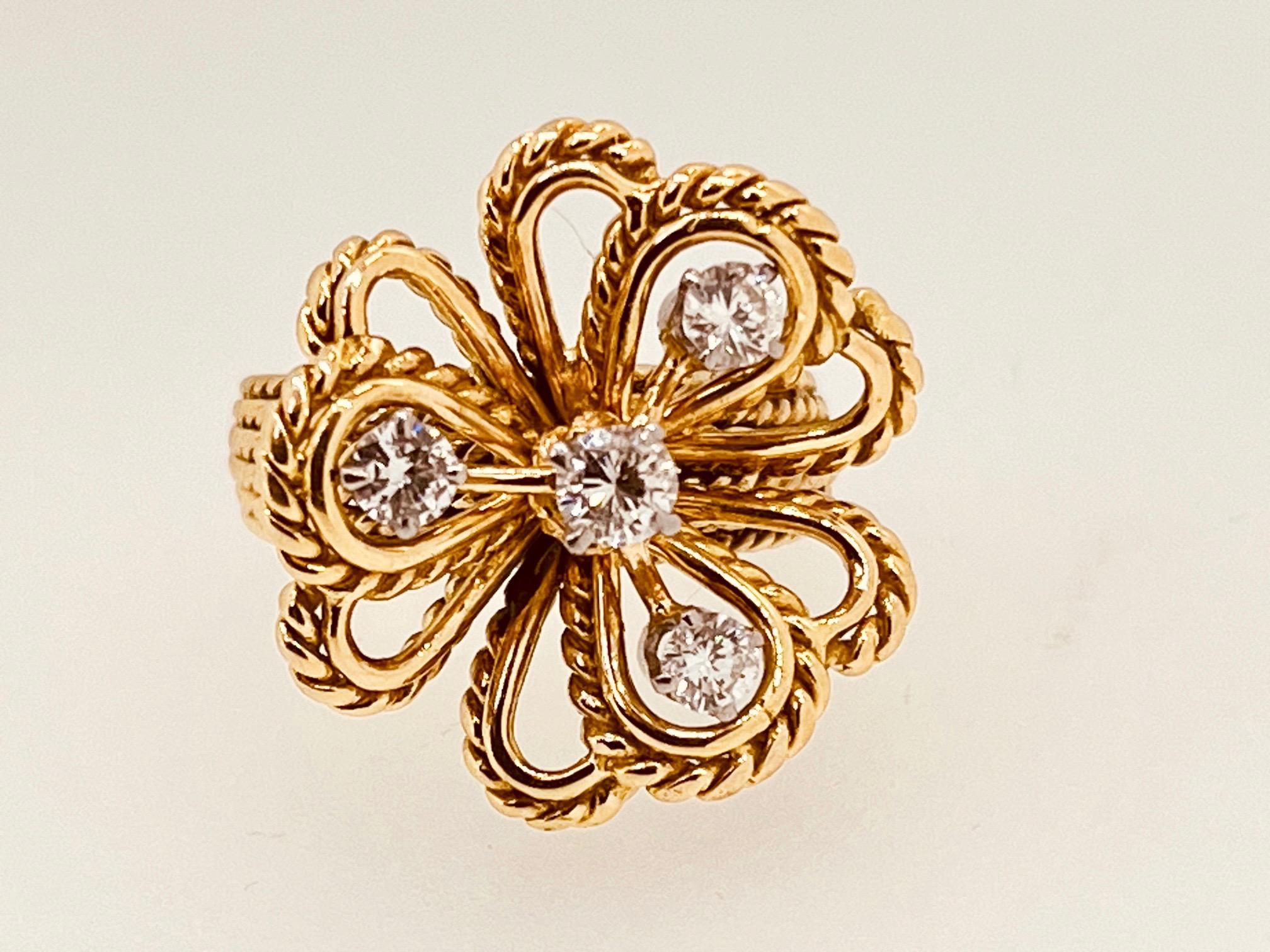 Tested 18ct Gold Flower Vintage Ring with 0.5ct Diamonds. Circa 1960s. The yellow gold flower suspended four brilliant round cut diamonds, approx. 0.5ct. Weight 10.7grams. Ring is resizable. Size is: L (UK), 52 (EU), 6 (US), 16.3mm (inside ring