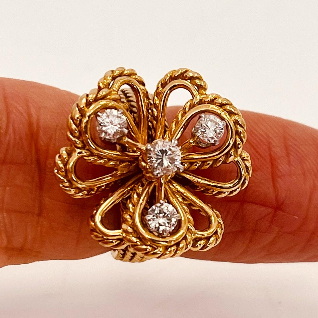 Women's 18ct Gold Vintage Flower Ring Suspending Four Brilliant Cut Diamonds Circa 1960s For Sale