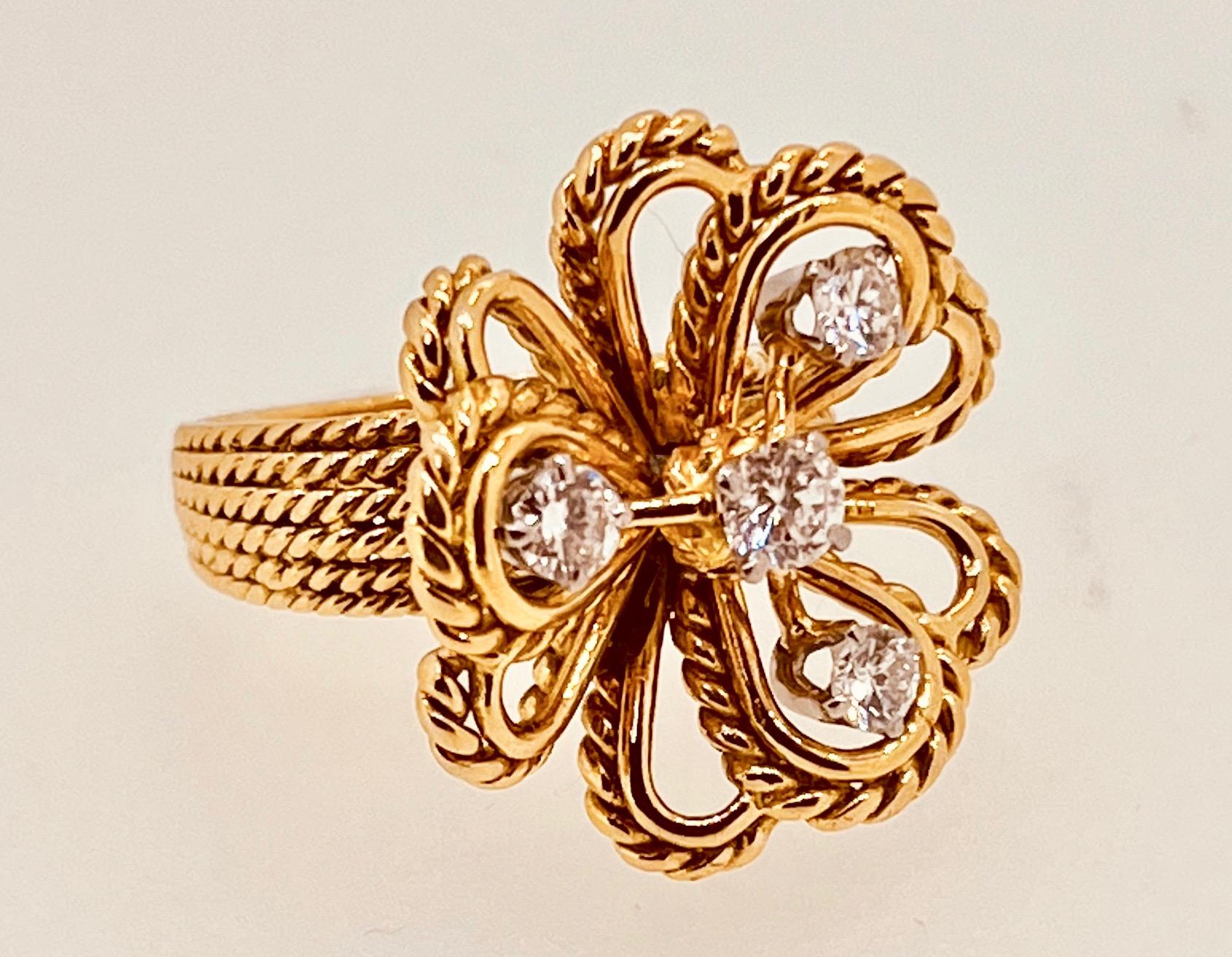 18ct Gold Vintage Flower Ring Suspending Four Brilliant Cut Diamonds Circa 1960s For Sale