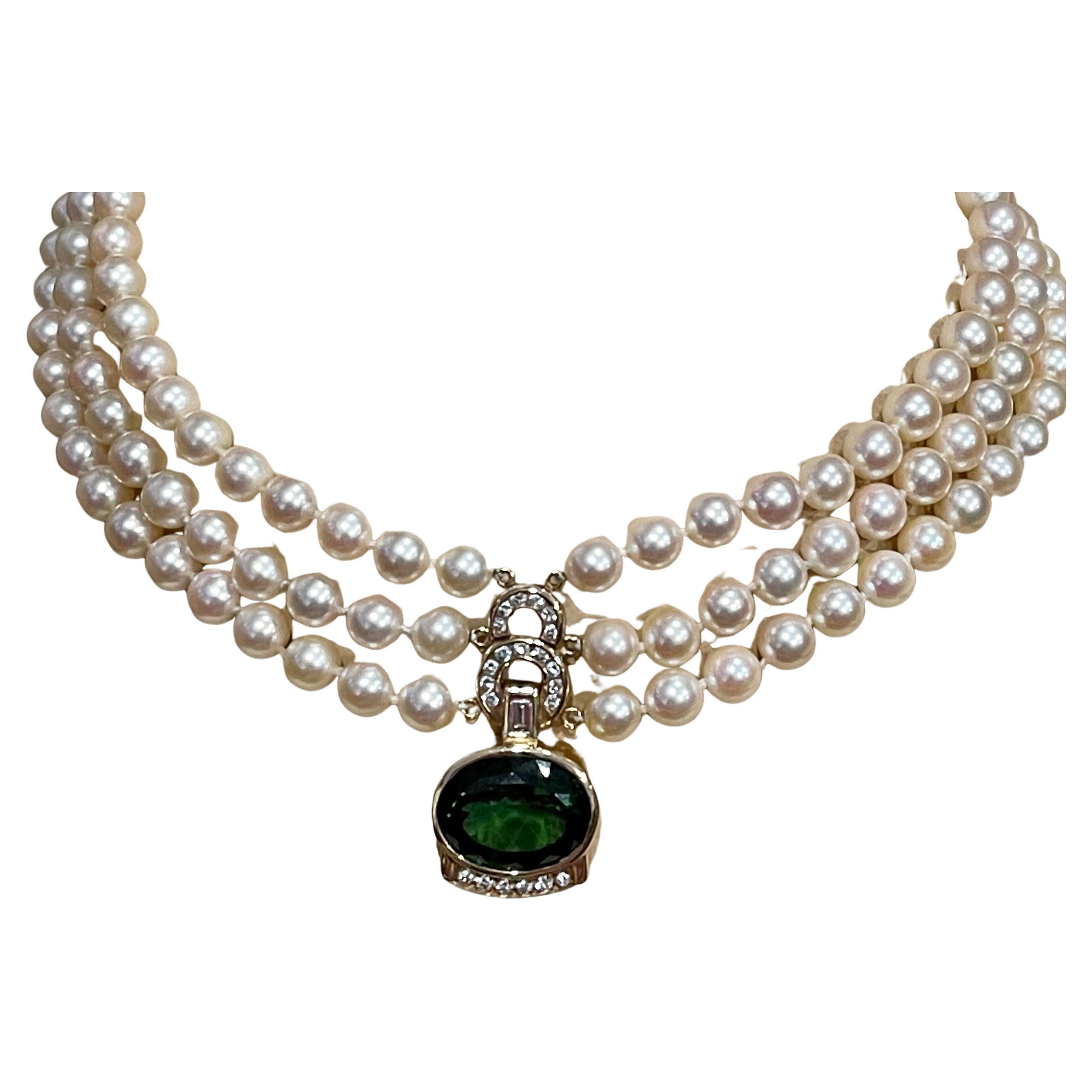 
Huge 18 Carat Green Tourmaline & 2.5 Carat Diamond Pendant / Necklace 14 Karat Yellow Gold and three layers of natural pearls, Estate
This spectacular Pendant Necklace  consisting of a single Oval Shape Green Tourmaline 18 Carat.  The  Green