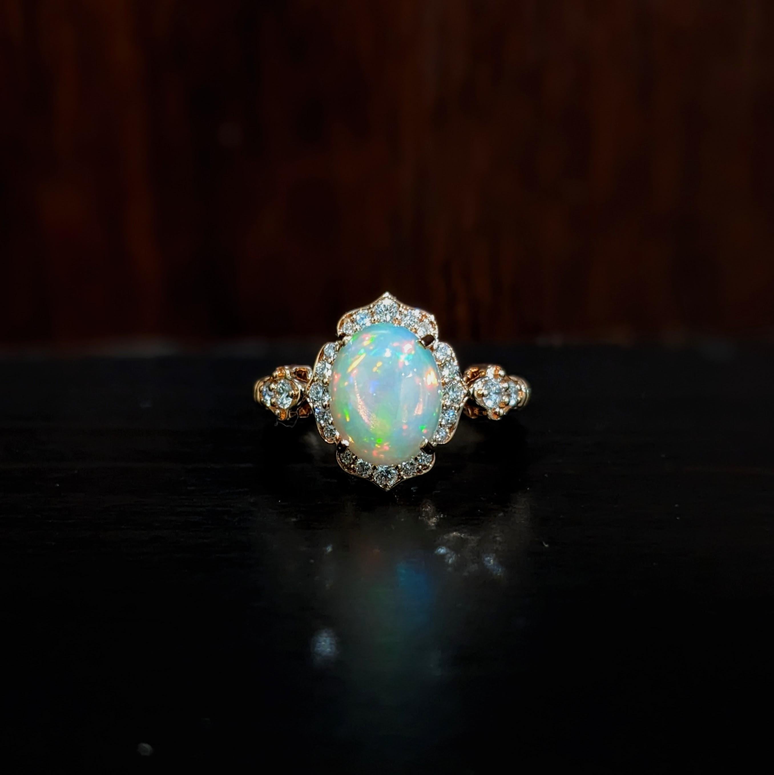 This beautiful ring features a 1.84 carat oval Opal gemstone with natural earth mined diamonds set in solid 14K gold. This Opal gemstone makes a lovely October birthstone gift for your loved ones! 

Specifications

Item Type: Ring
Center