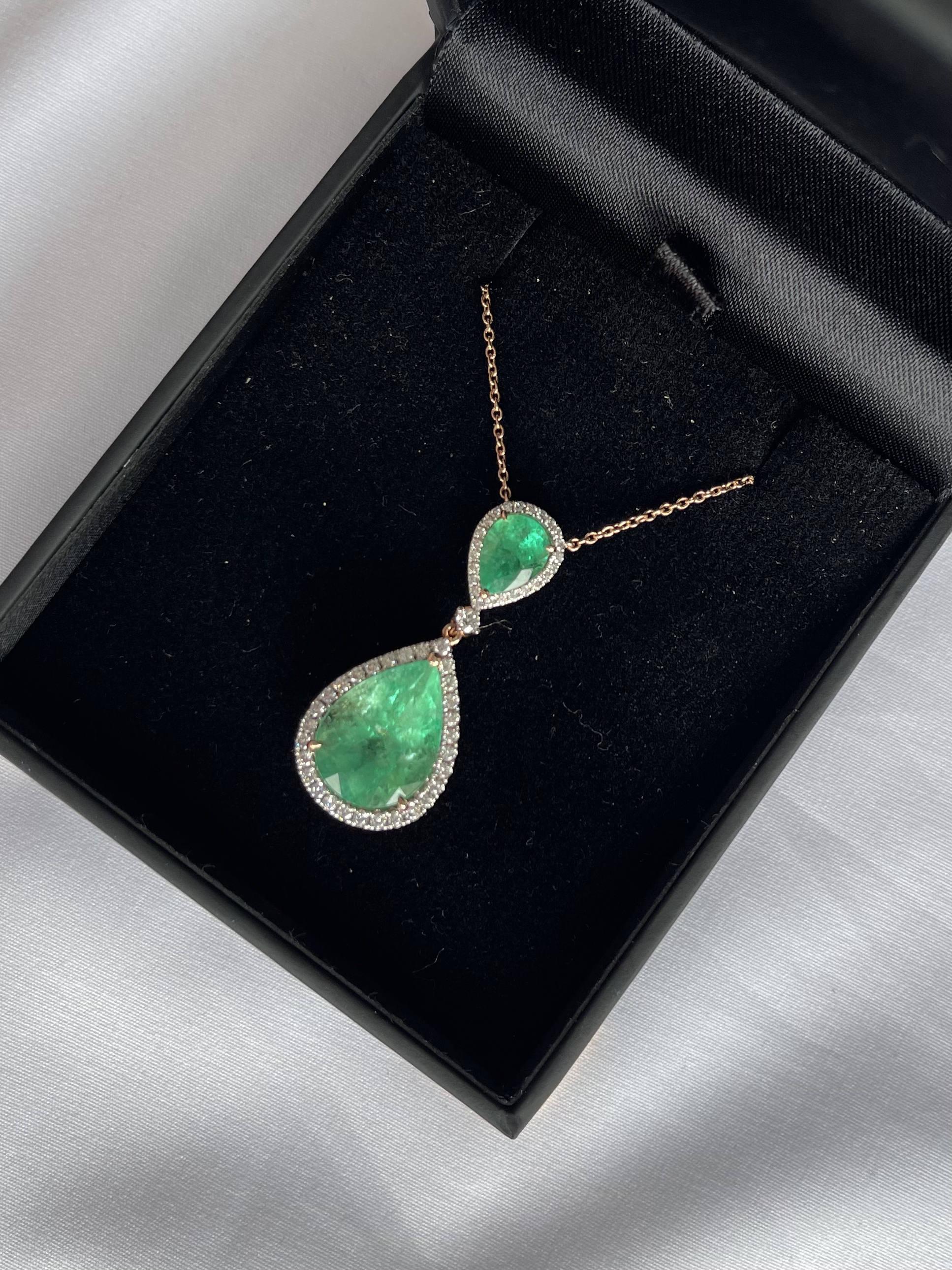 Pear shaped natural Colombian (based on my opinion) Emeralds , crafted with eighteen karat rose gold, featuring a stunning selection of fifty-eight claw and rub over set natural round brilliant cut diamonds, complemented by a polished finish design.