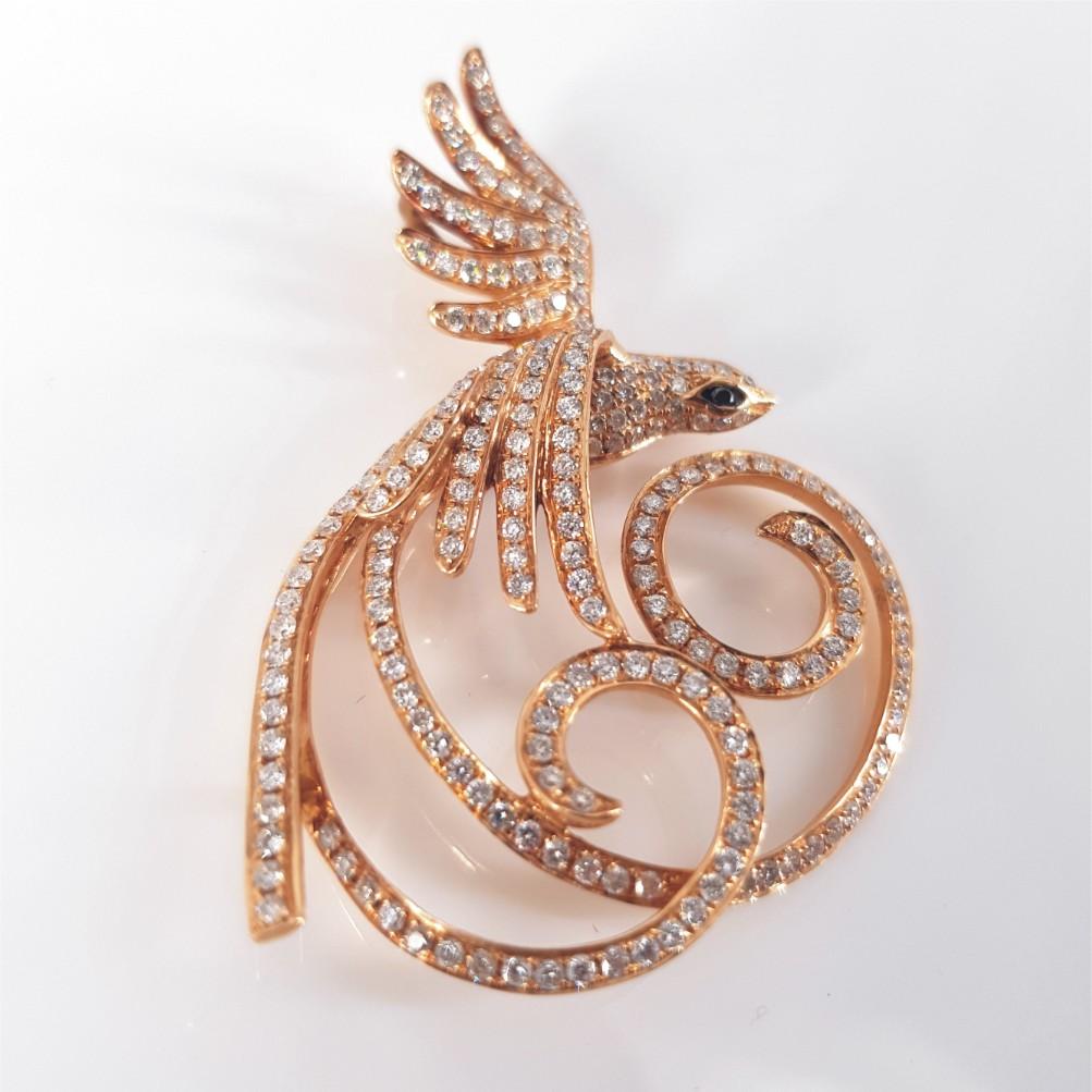 This Gorgeous 18ct Rose Gold Diamond Phoenix Pendant is carefully set with 230 beautiful round brilliant cut diamonds (GH vs-si) weighing 1.73carat in total and 1 Black RBC Diamond weighing 0.0075ct. This Pendant is 49mm in length and weighs 8.3