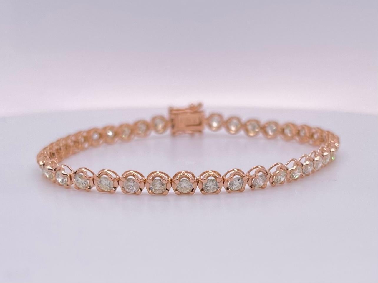 18ct rose gold diamond tennis bracelet.
Diamond weights: 3.41ct 
Diamond colour/clarity: H-I, VS2-SI2
Total item weight: 5.60 grams 
Total gemstone weight: 3.41ct 	        length: 170mm
Total metal weight: 4.92 grams          width: 4mm
