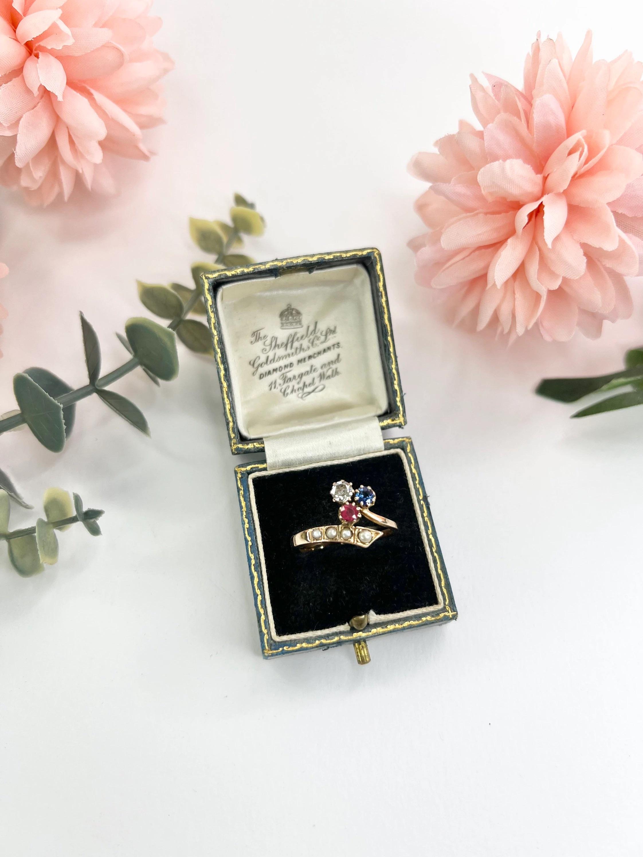Antique Clover Ring 

18ct Rose Gold Tested 

Circa 1900

Beautiful, Edwardian ‘Red, White & Blue’ Clover Ring. Set with Ruby, Diamond & Sapphire & a Natural Seed Pearl Crossover. 

Height of The Ring Measures Approx 11.5mm

UK Size R

US Size 8
