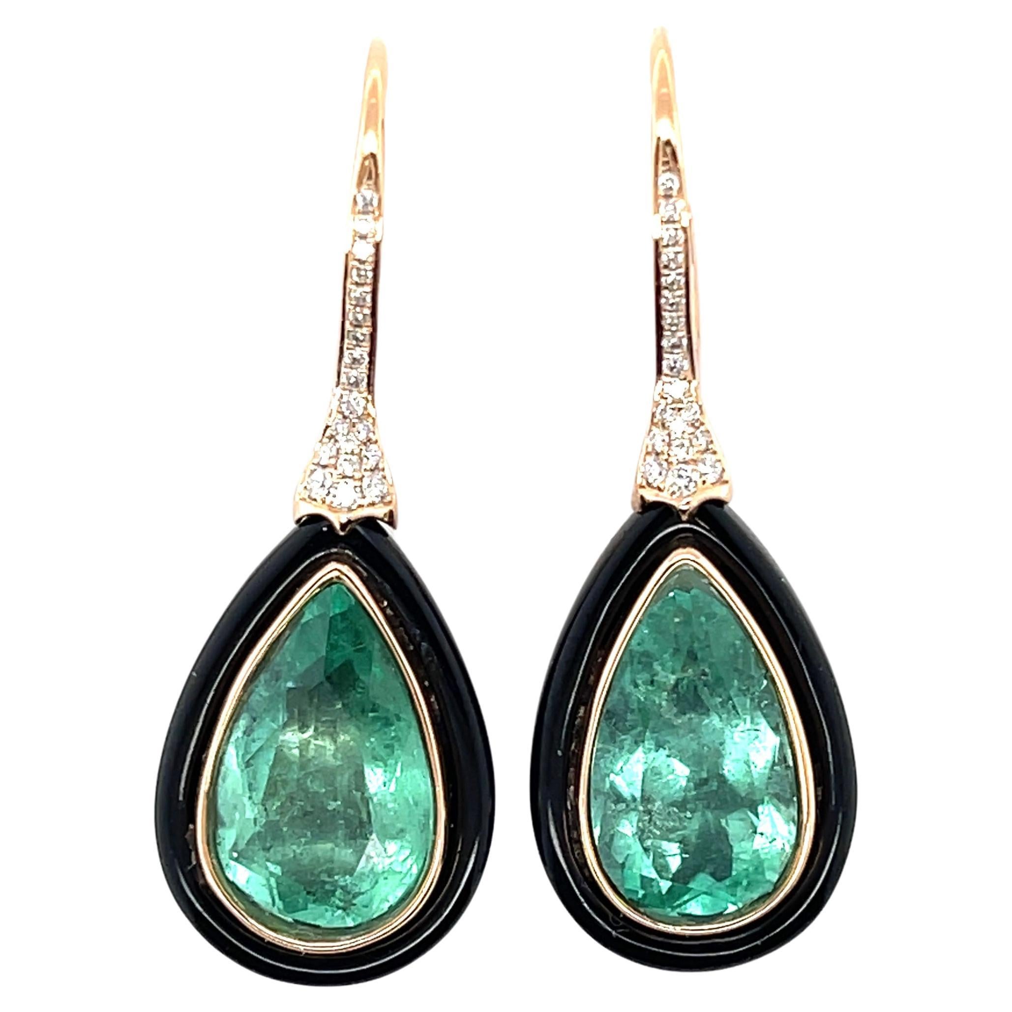 Pair of pear cut Colombian (based on my opinion) emeralds domed by black Onyx, crafted in eighteen karat rose gold, featuring  a stunning collection of thirty-eight claw set round brilliant cut diamonds. complimented by a beautiful polished finish