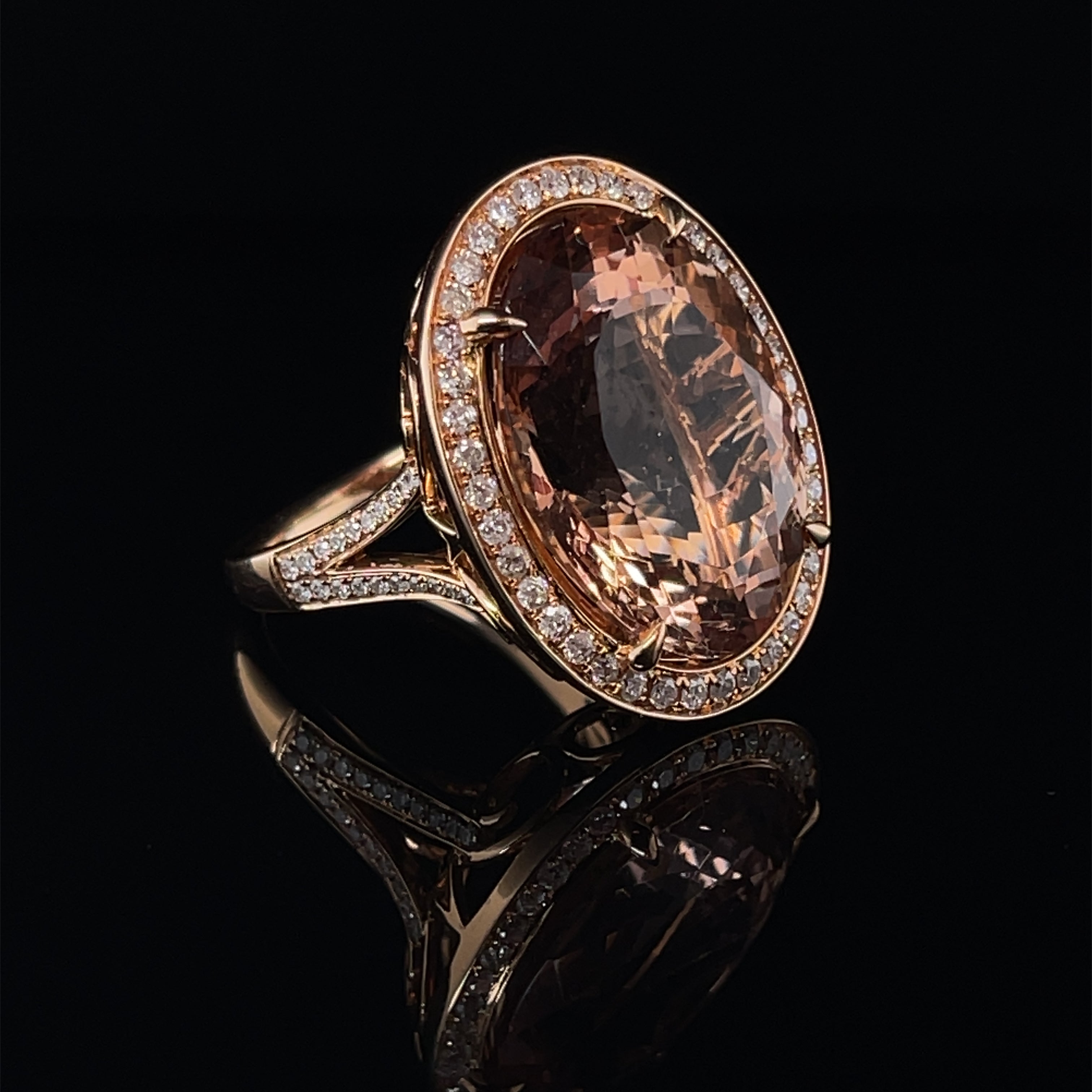 Oval shaped Morganite, crafted with eighteen karat rose gold, featuring an elegant selection of eighty bead set round brilliant cut diamonds, complemented by a stunning polished finish design. 

Morganite Weight: 18.56ct

Morganite Colour: 