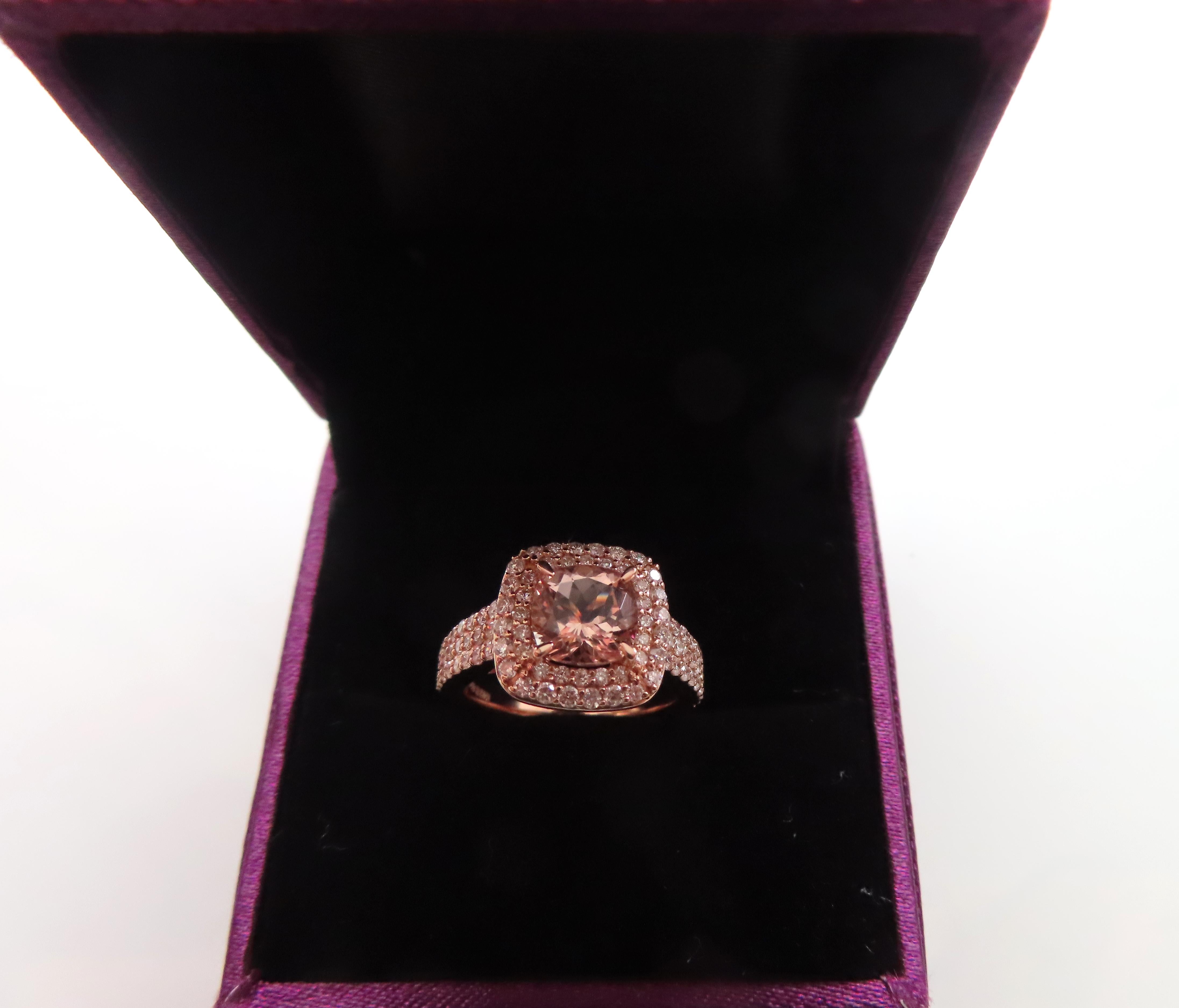 A beautiful  and stylish natural Morganite cushion shape ring well crafted in 18ct rose gold, surrounded by sparkling white diamonds.  

Morganite Cushion : 1.35 to 1.45ct
Diamonds: 0.90 to 0.95ct
Colour and Clarity: F Si
WGI London