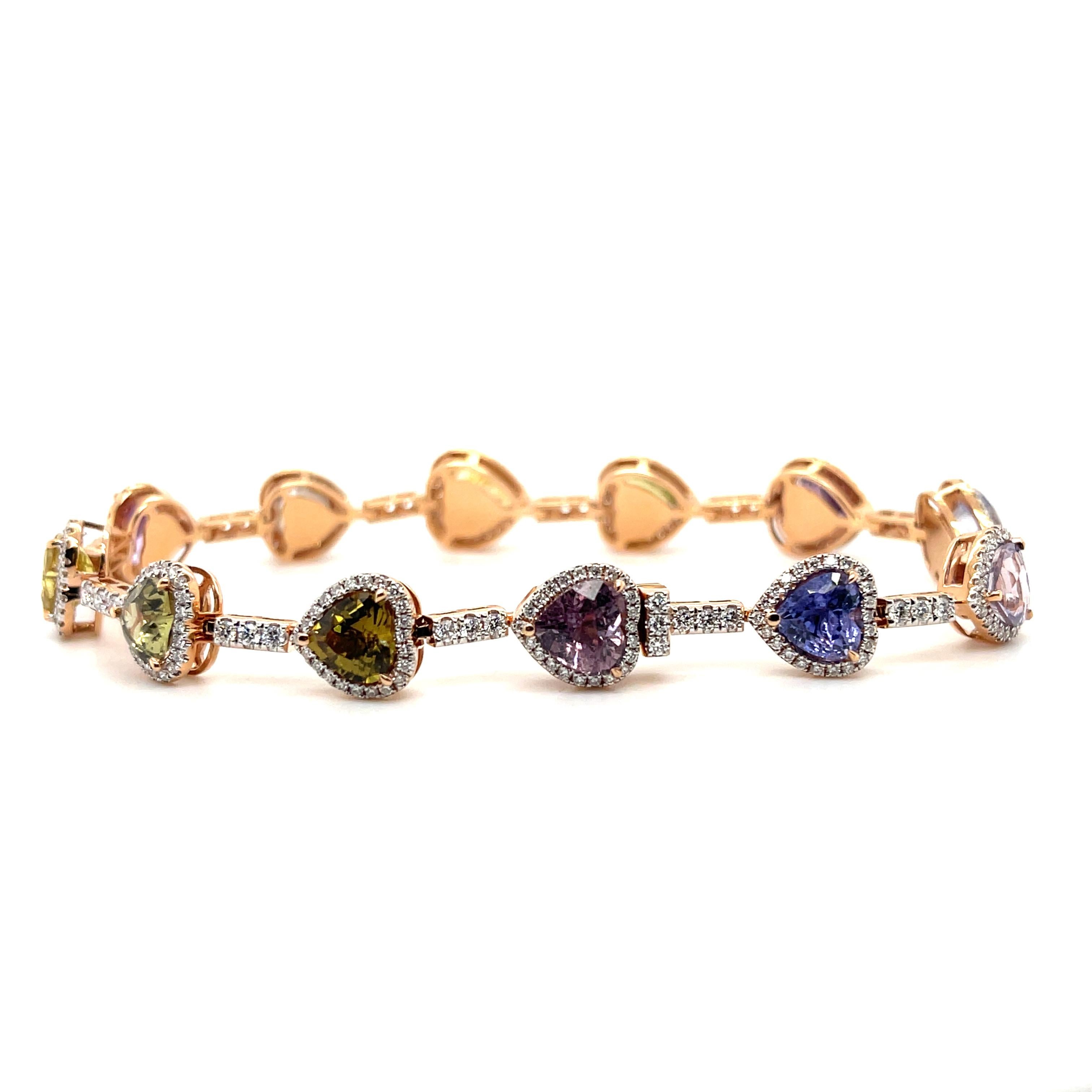 Multi coloured sapphires, crafted with eighteen karat rose gold, featuring a beautiful selection of three hundred and seventeen claw set round brilliant cut diamonds. complimented with a polished finish design.

Sapphires weight: 13.59ct

Sapphires