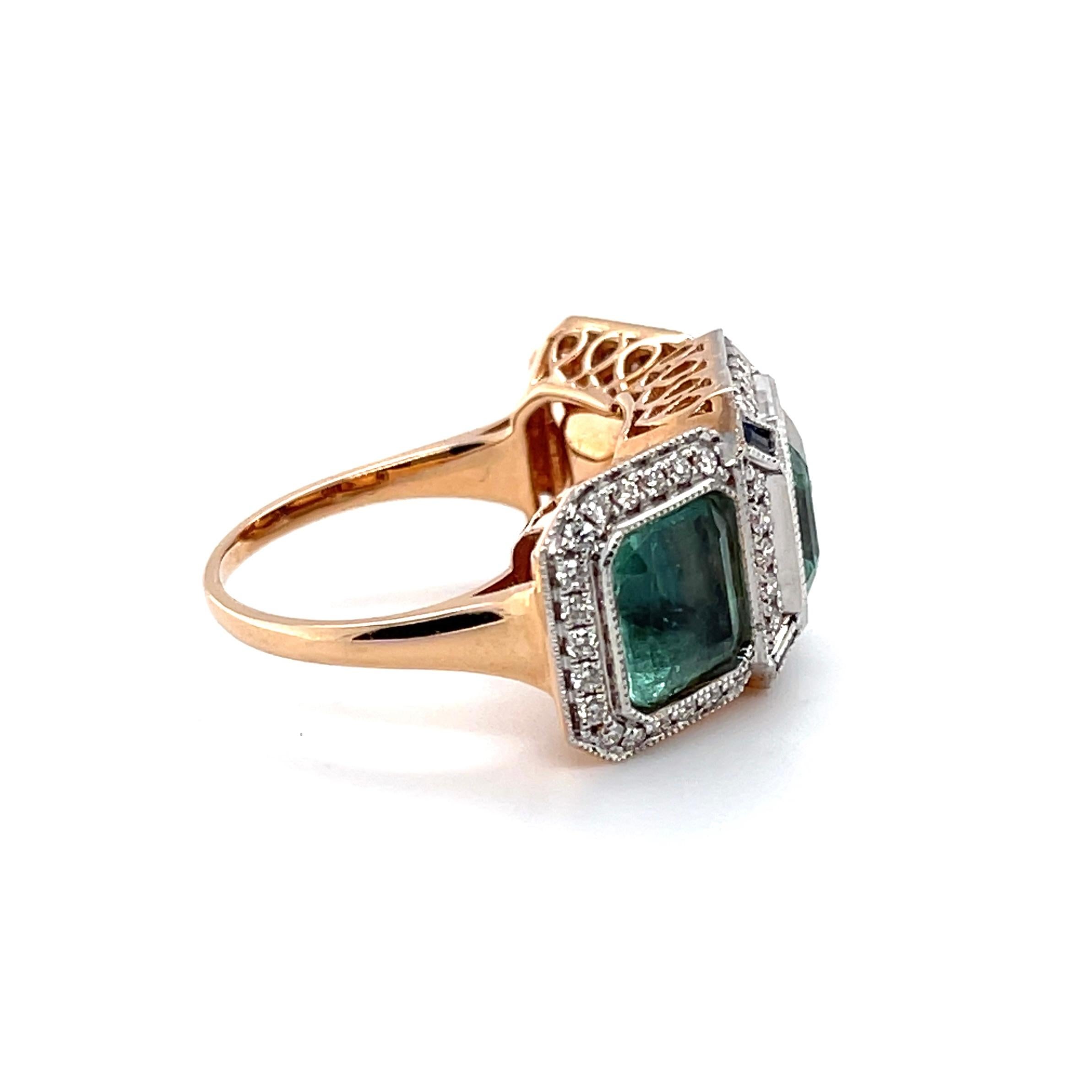 Contemporary 18ct Rose Gold Trilogy Emerald, Blue Sapphire and Diamond Ring For Sale