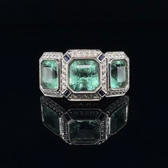 18ct Rose Gold Trilogy Emerald, Blue Sapphire and Diamond Ring