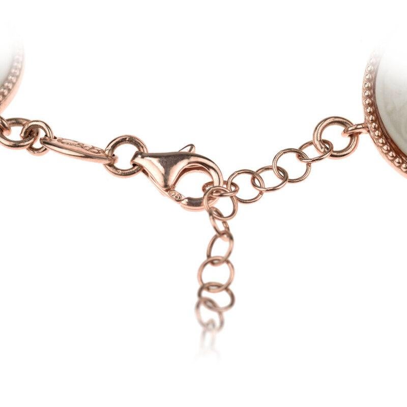 18ct rose gold vermeil and fine porcelain
Handmade in Italy

Exaggerated details celebrate exuberance in the Barocco collection inspired by 17th century architecture. Ancient motifs such as a woman wearing a fruit and flower hair ornament,