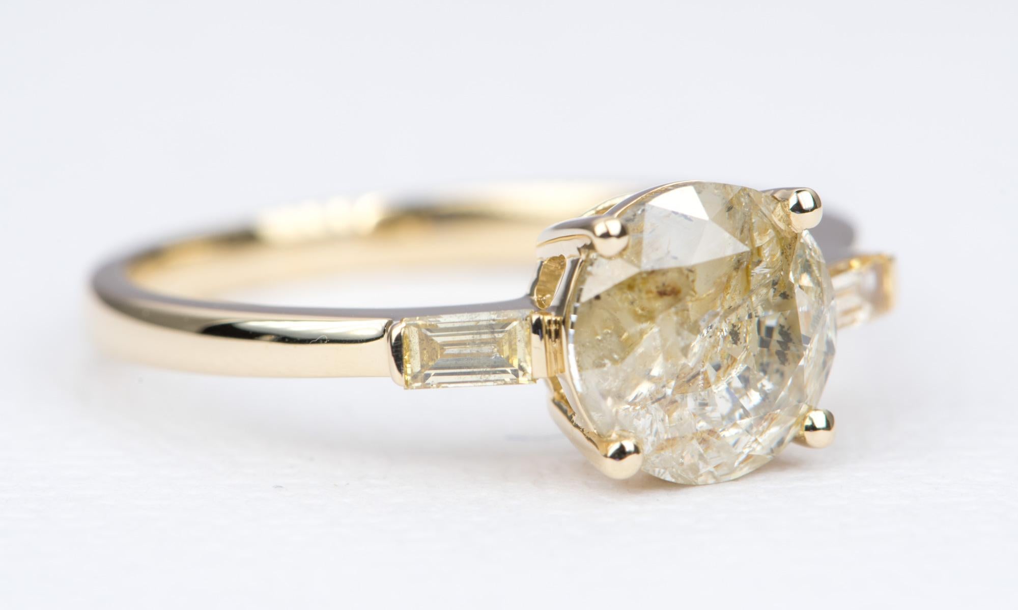 ♥  Solid 14K yellow gold ring set with a round brilliant cut champagne-colored diamond, flanked with baguette diamonds on the sides to complement the center stone
♥  The overall setting measures 15mm in width, 7.7mm in length, and sits 5.5mm tall