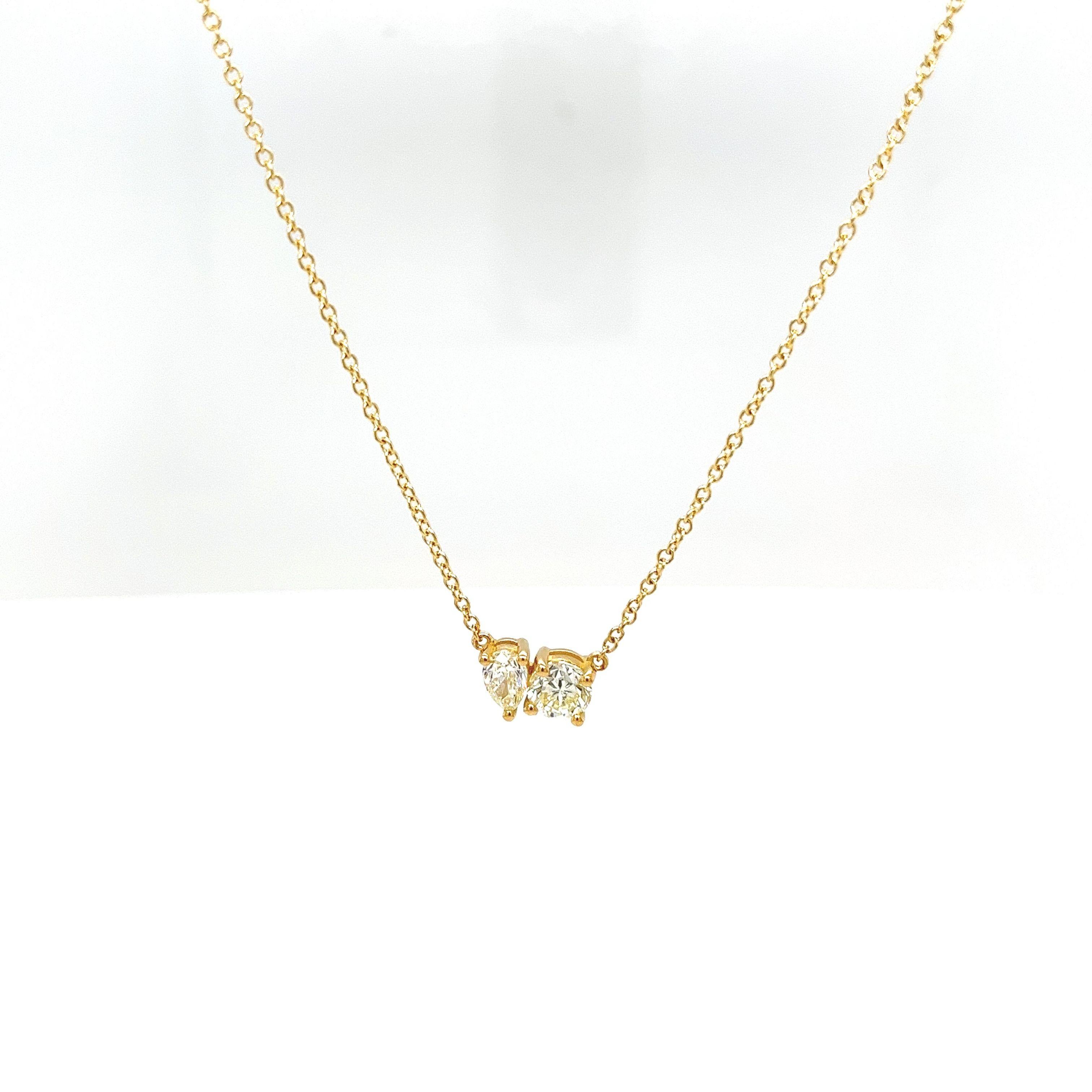 This gorgeous Toi Et Moi pendant is set with 0.30ct diamond pear shape and 0.50ct round brilliant cut diamond M-N colour and VSclarity in 18ct yellow gold. 
The pendant is suspended from a 18ct yellow gold chain that measures 18 inches adjustable at