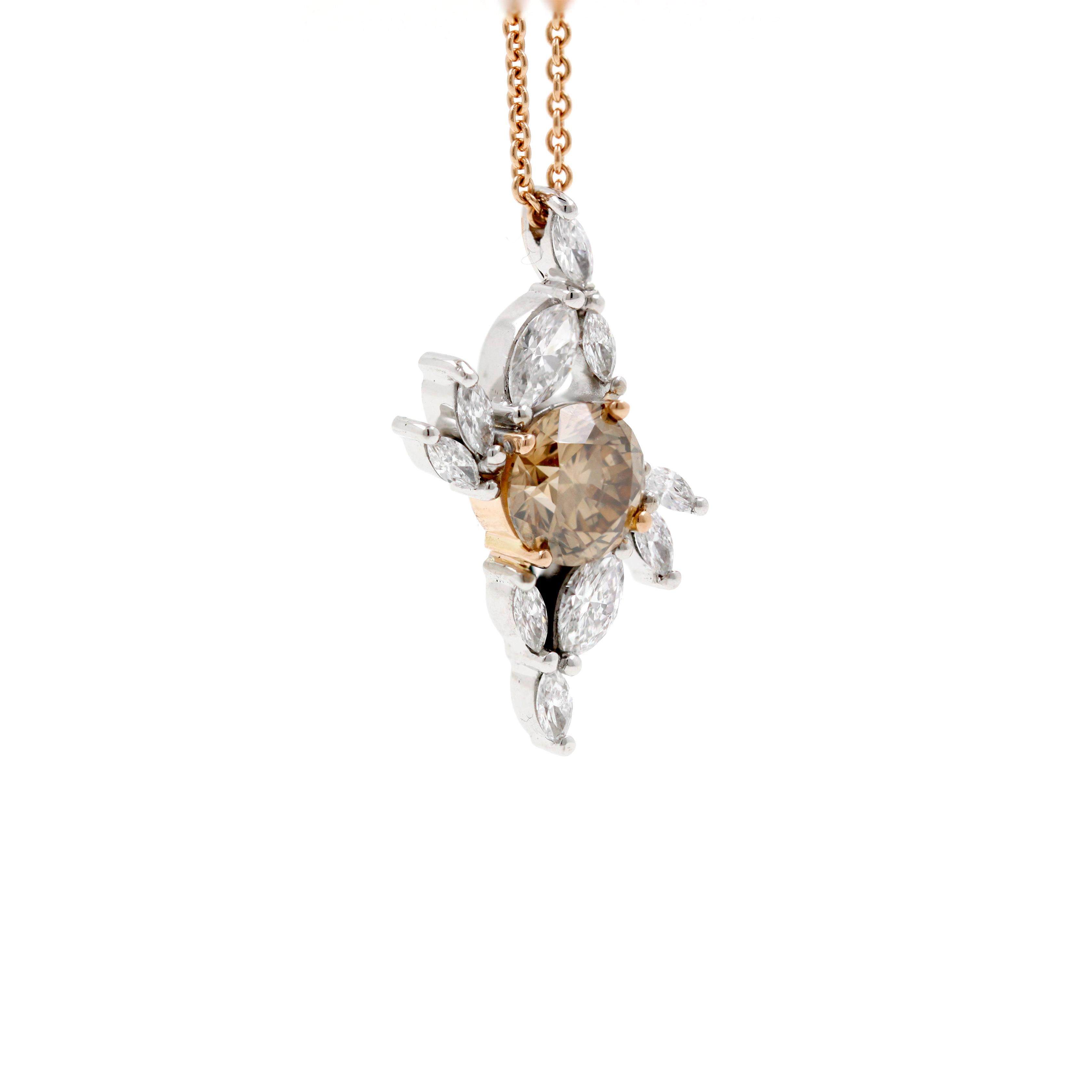 One handcrafted 18ct white and rose gold pendant, featuring a 1.16ct Argyle Champagne round brilliant cut diamond of C5 colour and VS1 clarity (RTARG103903, Argyle Orignis certificate #2170A) surrounded by an asymmetrical cluster of 10=0.548ct