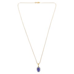 18 Carat White and Yellow Gold Oval Tanzanite Pendant Necklace