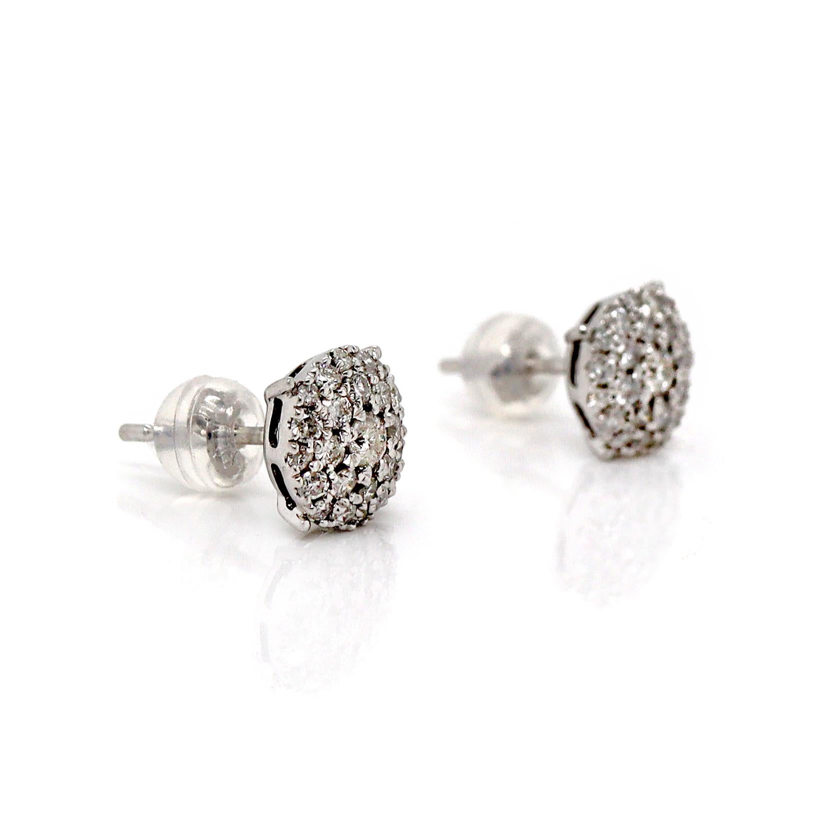 18CT White Gold Diamond Cluster Earrings

These 18ct white gold cluster diamond earrings feature a stunning arrangement of diamonds set in a dainty, circular cluster design. The earrings are crafted in lustrous white gold, which enhances the sparkle