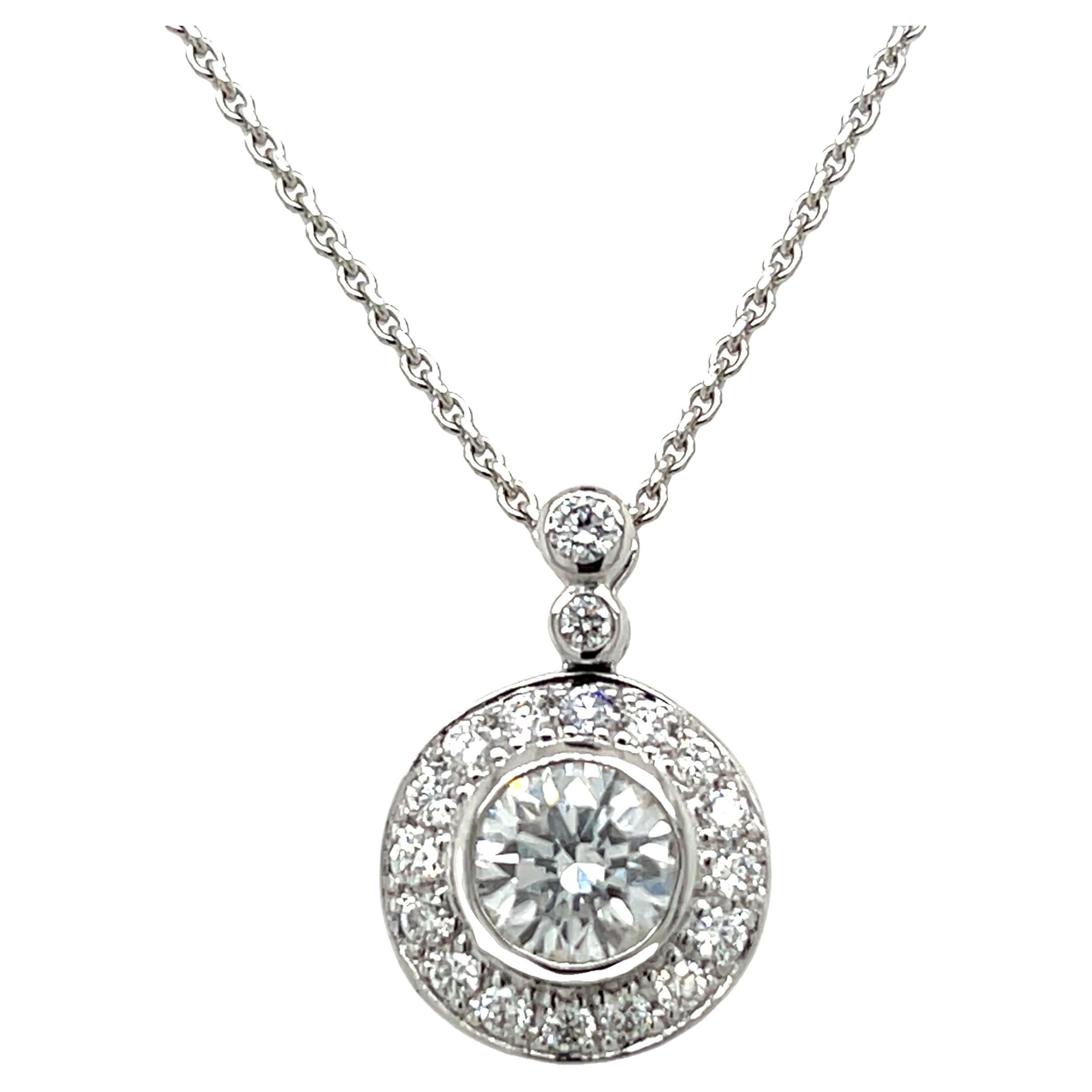 18ct White Gold 0.80ct Diamond Halo Pendant Suspended from 16" Chain