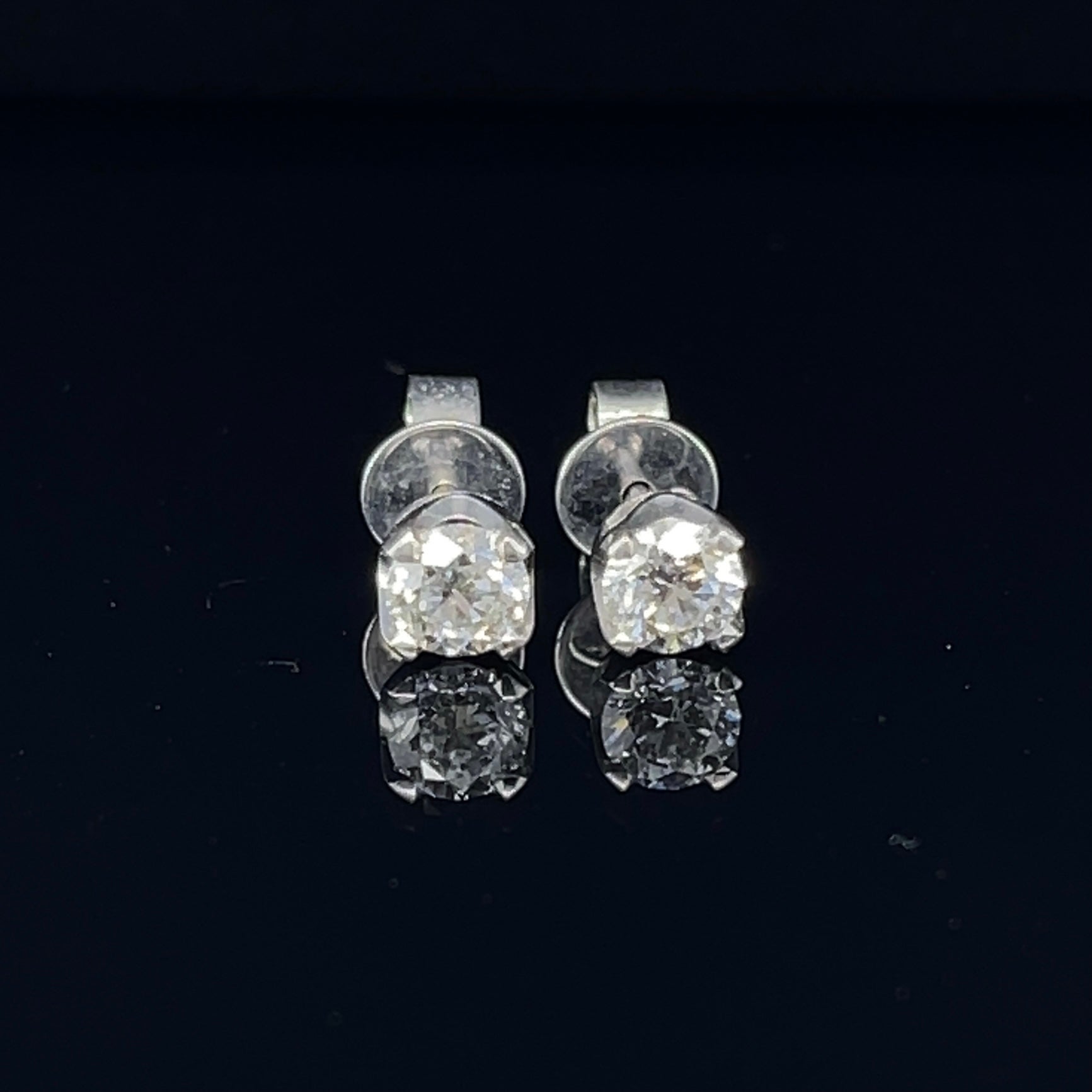 Diamond stud earrings, crafted with eighteen karat white gold, featuring two claw set round brilliant cut diamonds and complemented with a beautiful polished finish design. 

Diamond Weight: 0.85ct 
Diamond Colour/Clarity: 