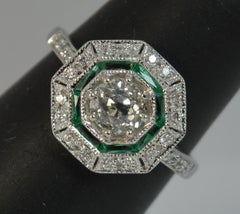 18 Carat Gold 0.85 Carat Old European Cut Diamond and Emerald Target Halo Ring