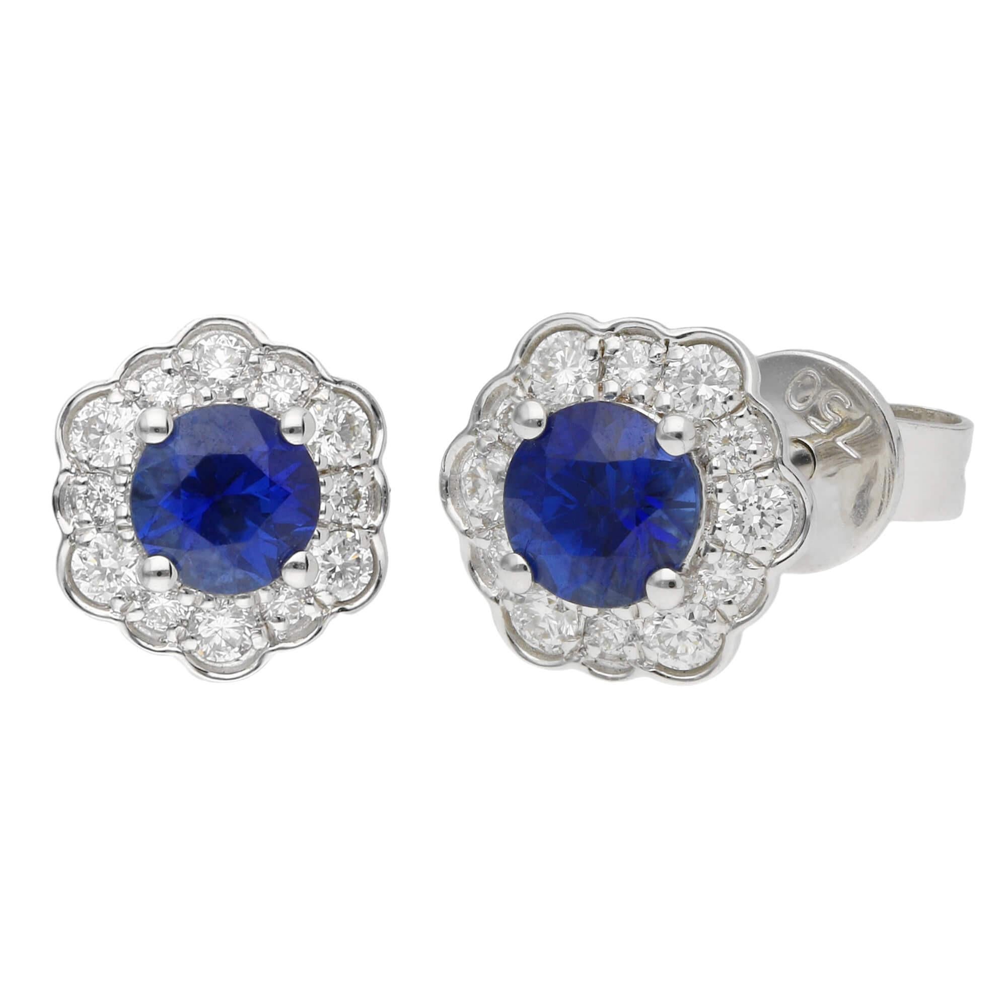 18ct White Gold 0.95ct Sapphire & 0.49ct Diamond Floral Cluster Earrings

These enchanting floral cluster earrings are masterfully crafted from 18ct white gold, each set with a stunning round-cut sapphire at the centre. These deep blue sapphires,