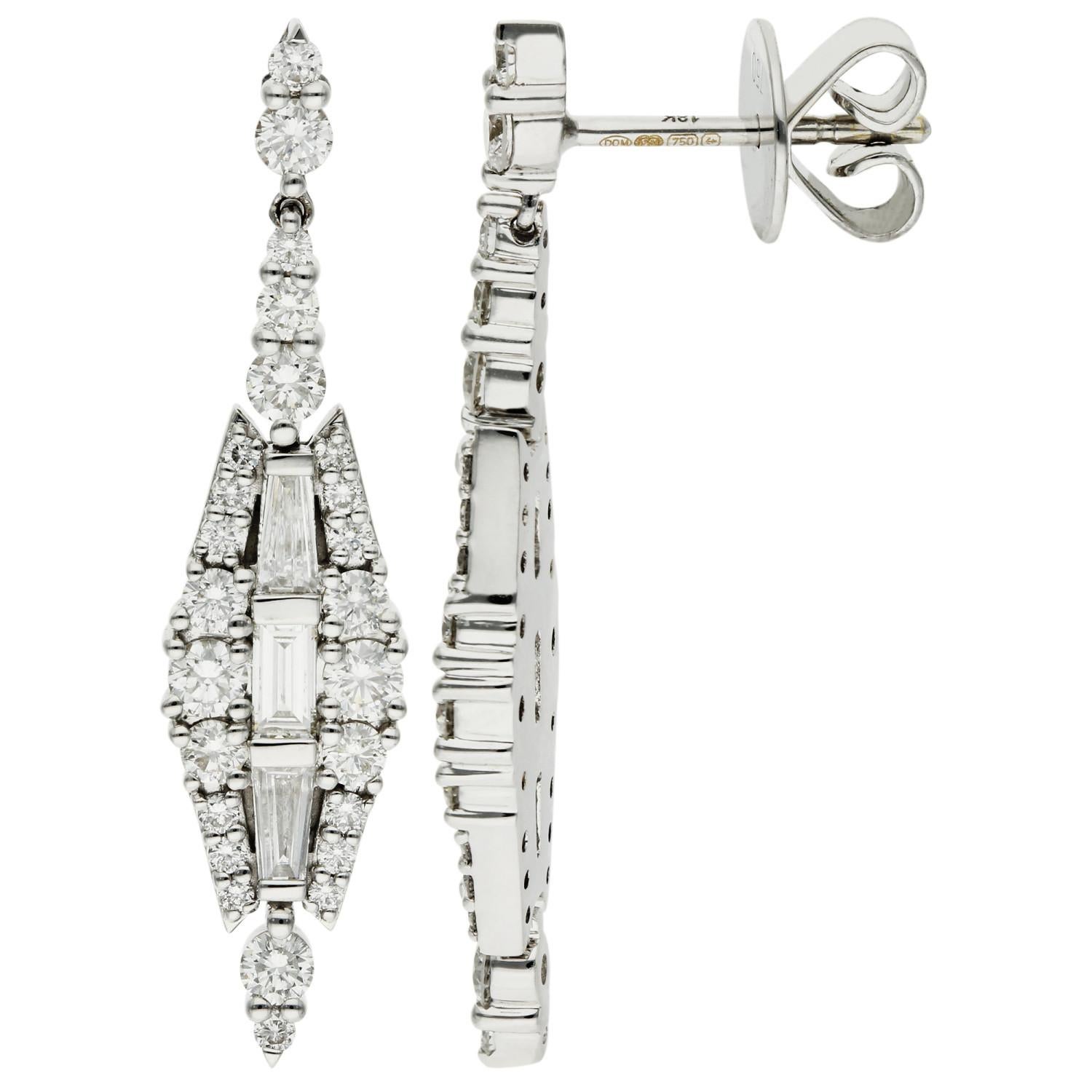 Elevate your elegance with our stunning 18ct White Gold Diamond Drop Earrings, a masterpiece of craftsmanship and style. These exquisite earrings feature a dazzling display of graduated round brilliant cut diamonds, artfully arranged to frame a