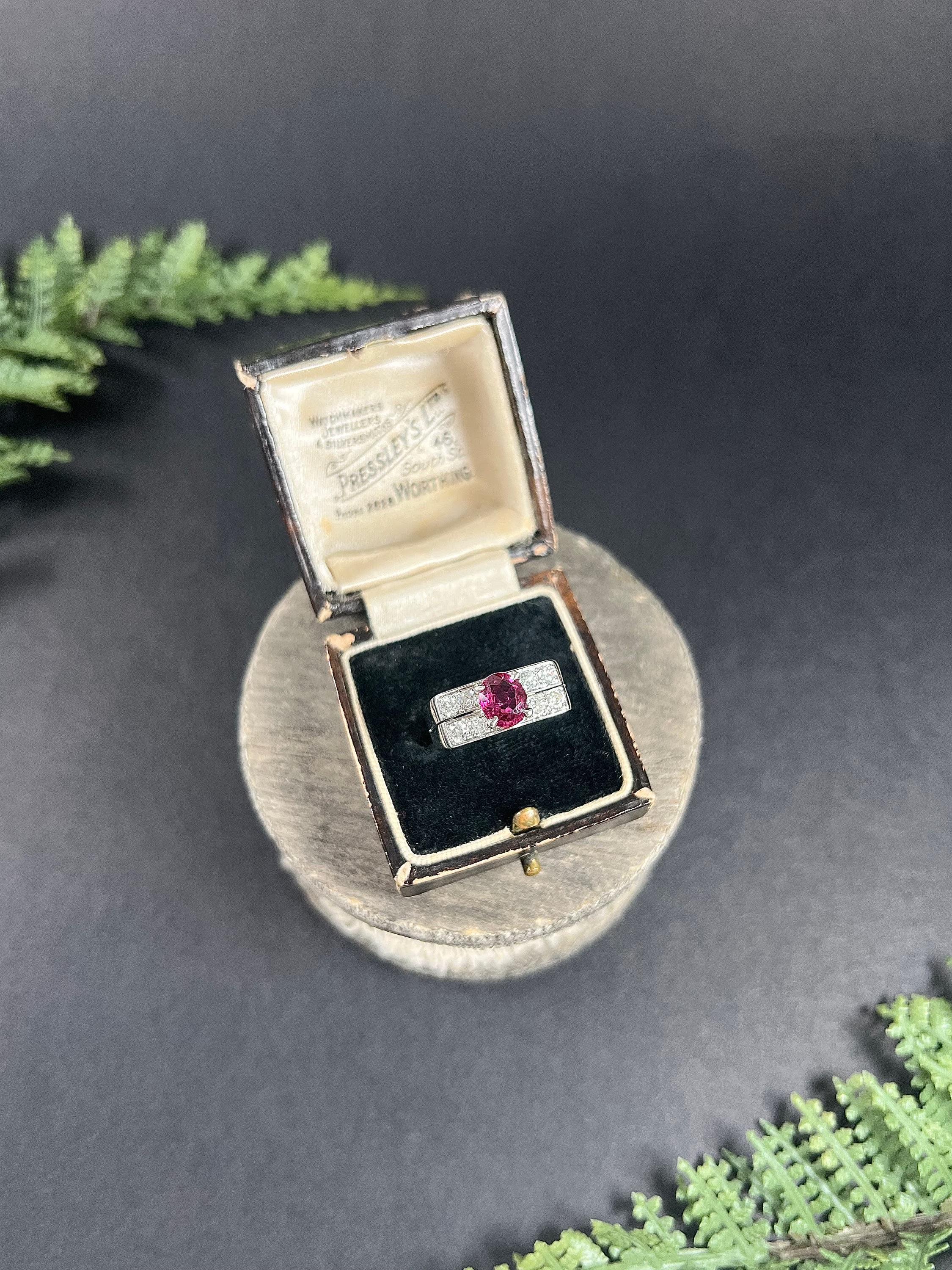 Vintage Cocktail Ring 

18ct White Gold French Stamped

Circa 1930s

Behold this stunning vintage 1930s tank-style cocktail ring! Crafted in 18ct white gold, this exquisite ring features two rows of dazzling French white diamonds and an oval-faceted