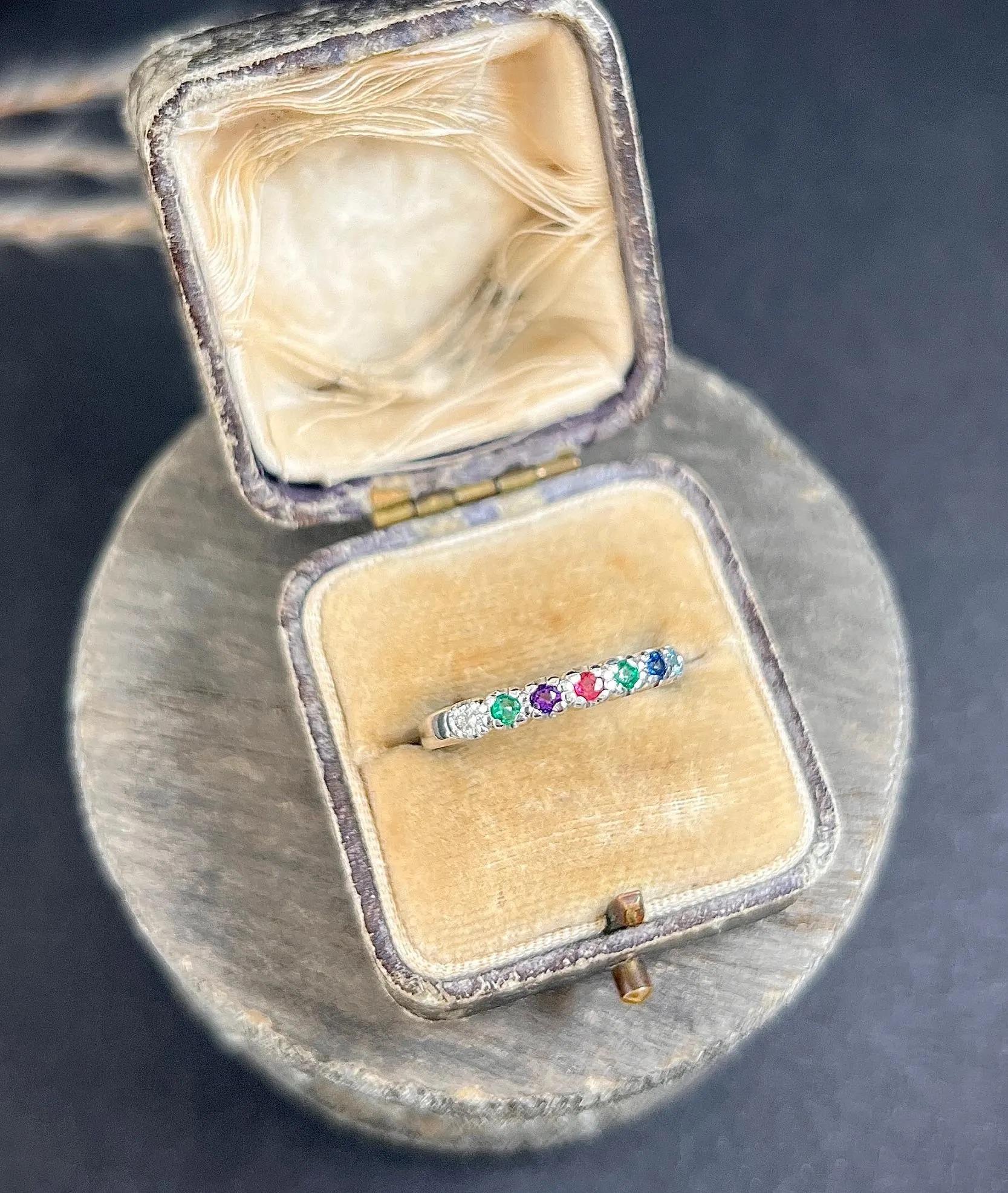 Antique Dearest Ring 

18ct White Gold Stamped

Circa 1980

This vintage 1980s acrostic ring is a truly unique piece. The gemstones are arranged from left to right as diamond, emerald, amethyst, ruby, emerald, sapphire, and topaz, spelling out