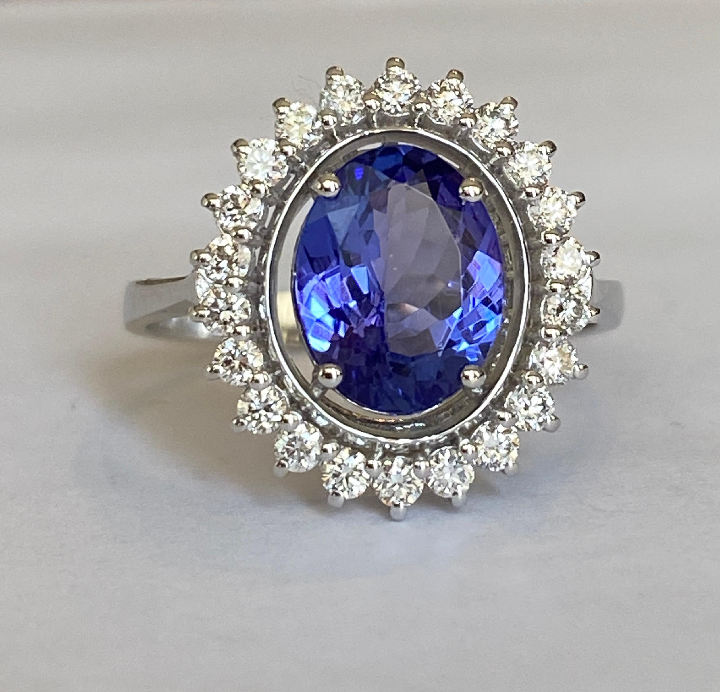 Offered in new  condition, Diana Cocktail ring in white gold, with an oval cut tanzanite of 2.00 ct. The stone is surrounded by an entourage of 22  pieces of brilliant cut diamonds, approx. 0.50 ct in total, of quality G/VS/SI. Own certificate is
