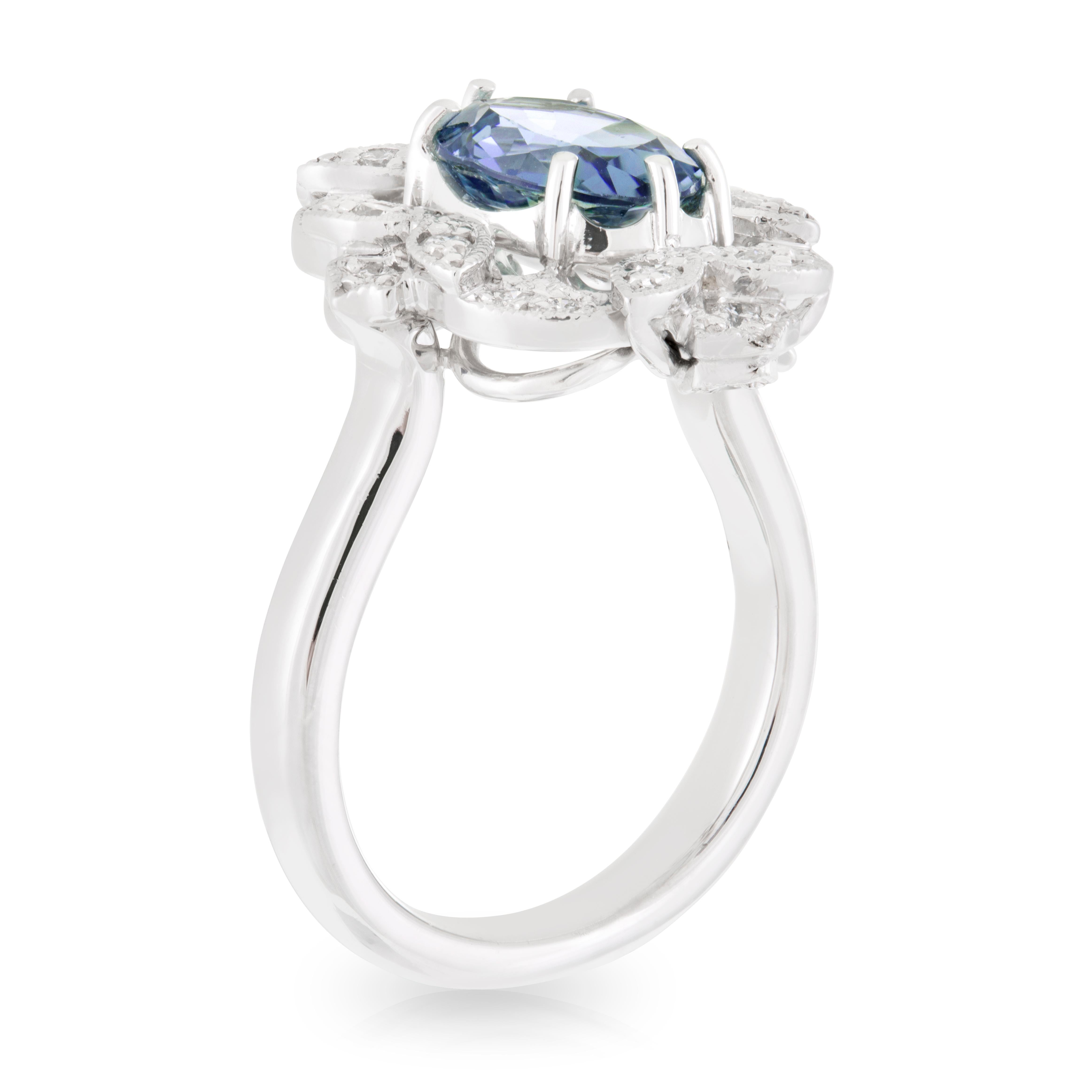 18ct White Gold 2.01ct Oval Ceylon Blue Sapphire with Art Deco style Diamond Halo Engagement Ring. TDW 0.26ct.