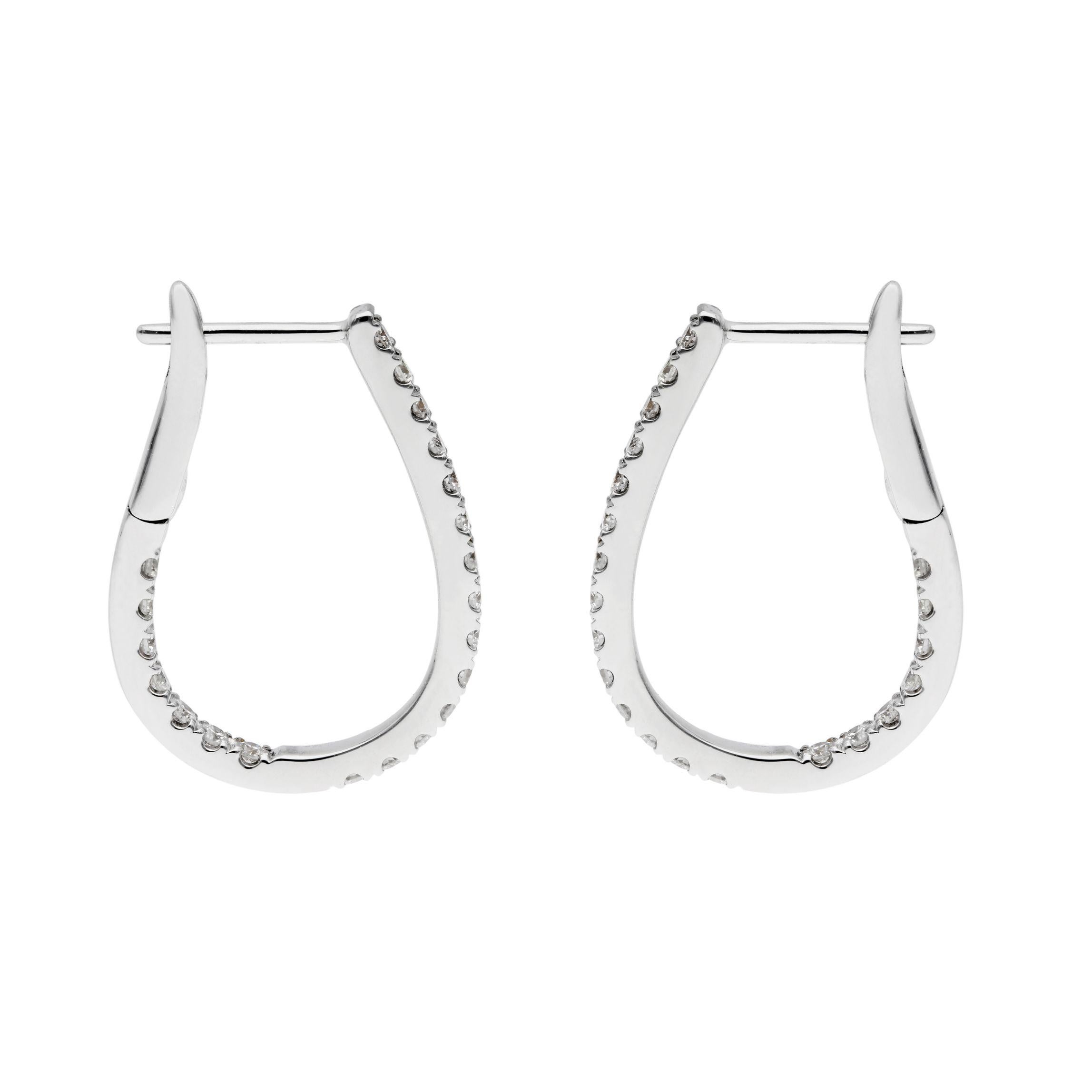 Discover the epitome of sophisticated glamour with our 18ct White Gold 22mm Diamond Hinged Hoop Earrings. Uniquely designed in a chic horseshoe shape, these earrings add a modern twist to the classic hoop. The front and inside back of each earring