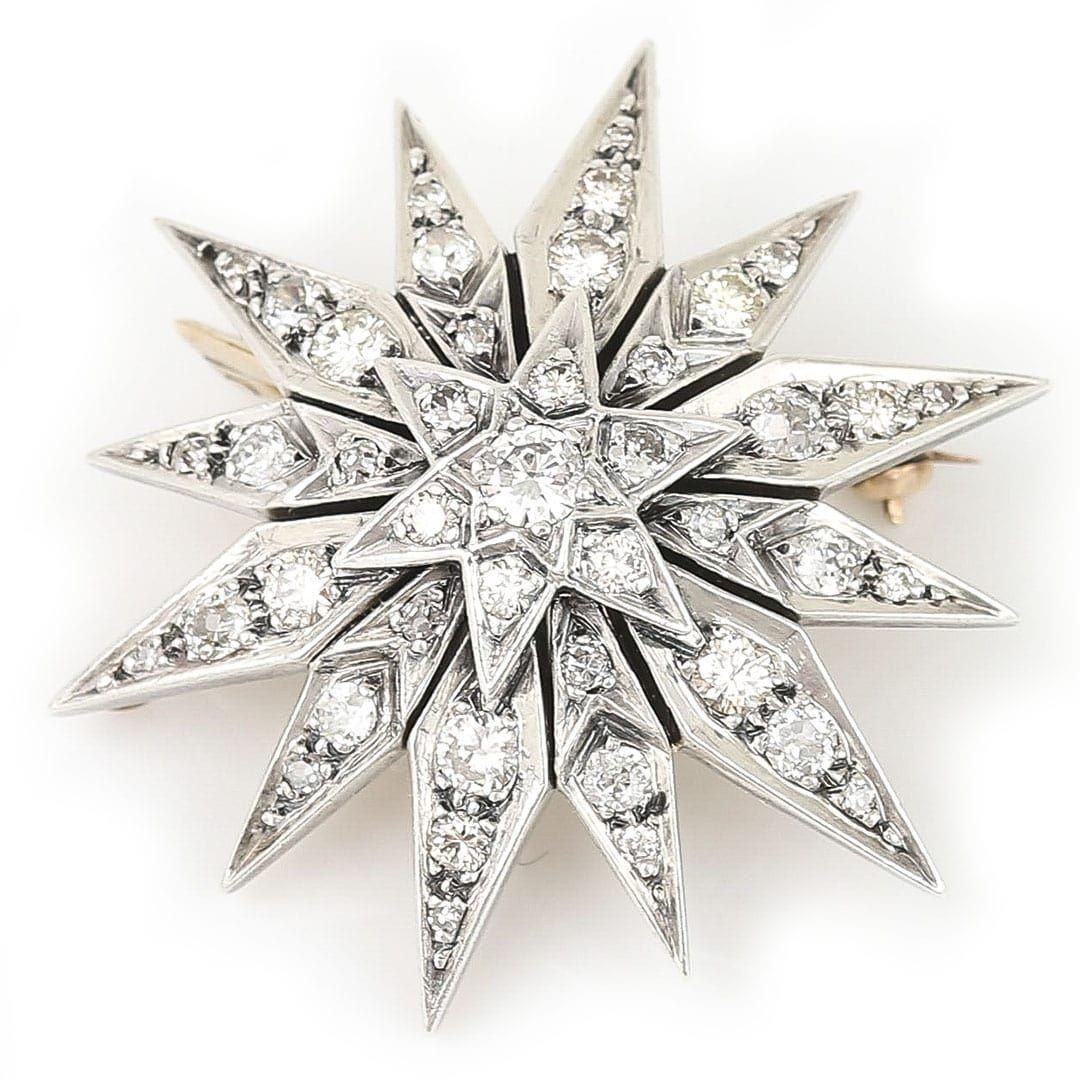 A stunning mid century brilliant cut diamond star ‘sunburst’ brooch dating from around 1950 comprising of approx 2.30ct of diamonds. This fabulous brooch, measuring 42mm diameter is set in 18ct gold with a silver front, and is made in a typical