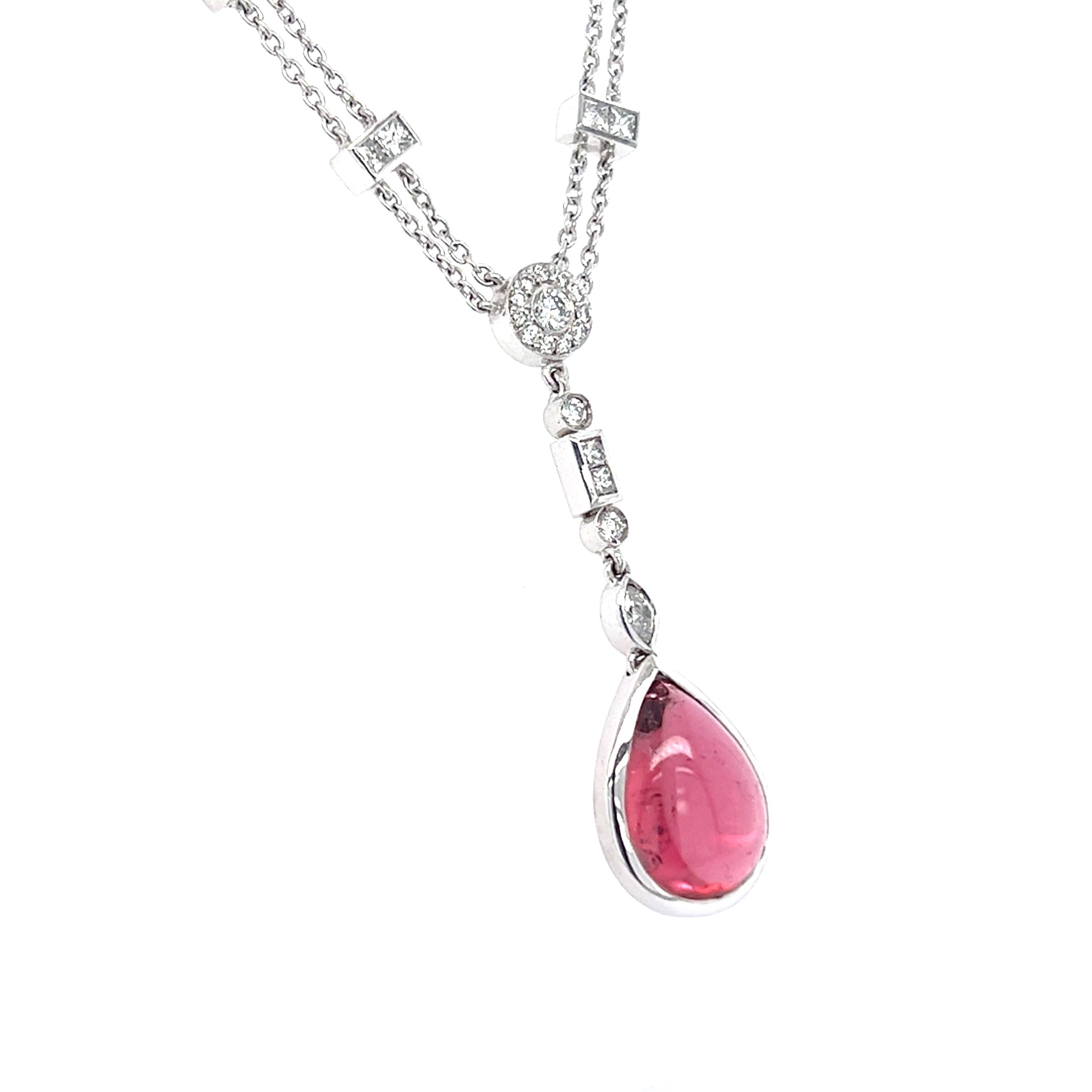 This 18-carat white gold necklace features pink, pear-shaped cabochon tourmaline, totalling 2.59ct. This gemstone is accompanied by 18 round brilliant cut white diamonds totalling 0.40ct, 1 marquise cut white diamond totalling 0.08ct and 10 princess
