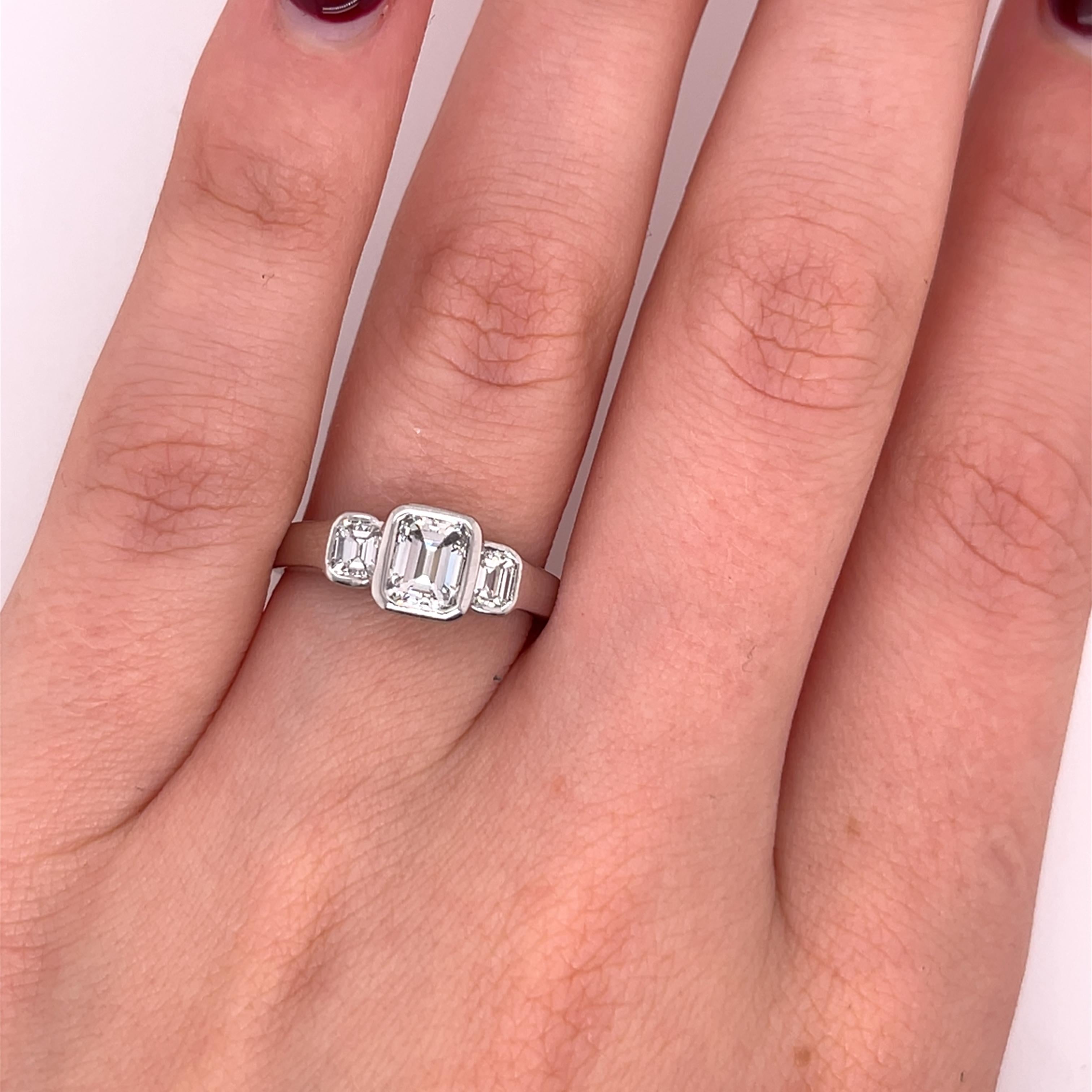 An elegant 18ct white gold ring, set with three stunning emerald-cut diamonds, showcasing a timeless and sophisticated design. 
Perfect for celebrating life's most cherished milestones.

Total Diamond Weight: 1.09ct
Diamond Colour: G-H
Diamond