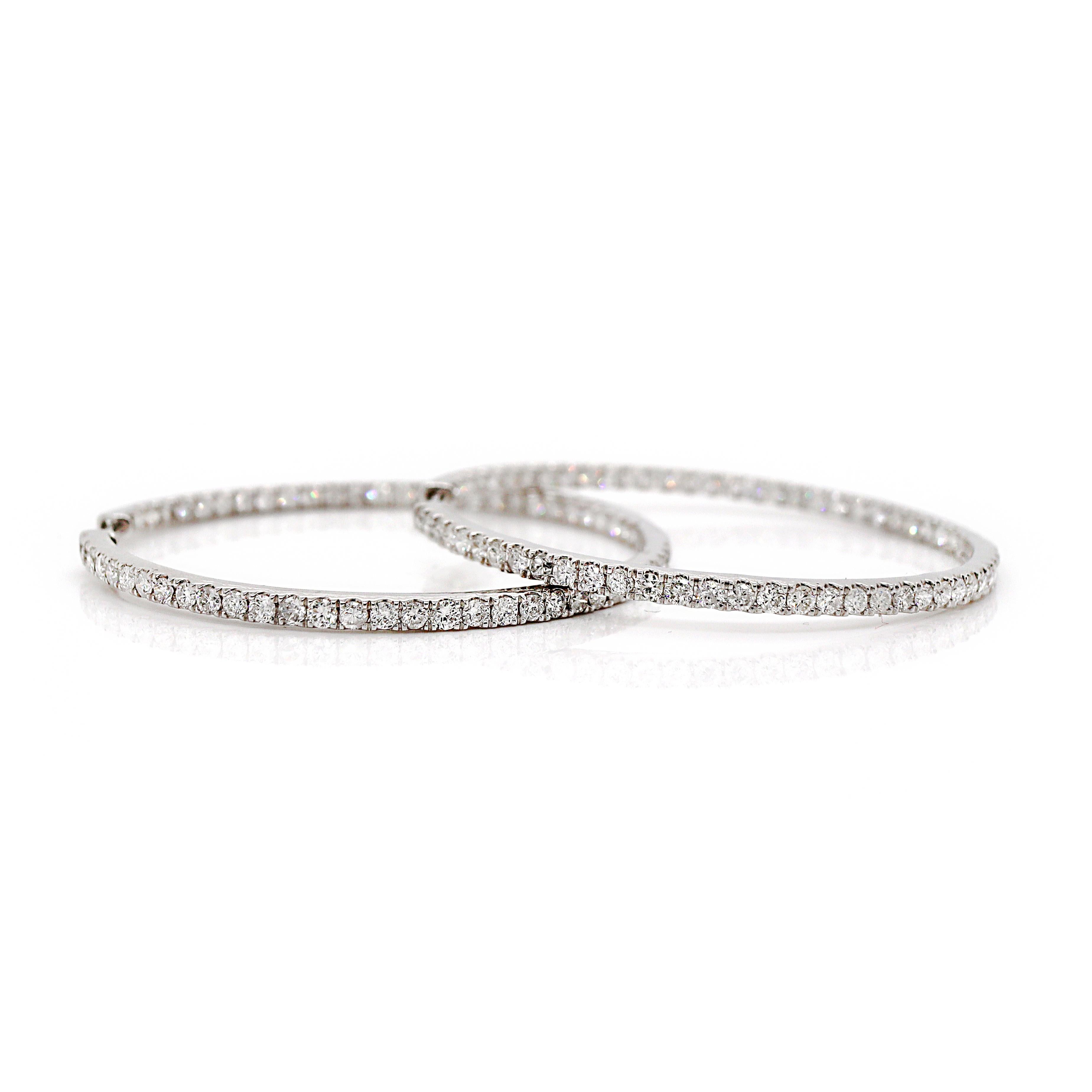 18CT White Gold 3.00CT Diamond Hoop Earrings 

These 18ct white gold diamond hoop earrings feature a sleek, timeless design, with diamonds set along the outer curve of the hoops for a dazzling effect. The white gold setting enhances the brilliance