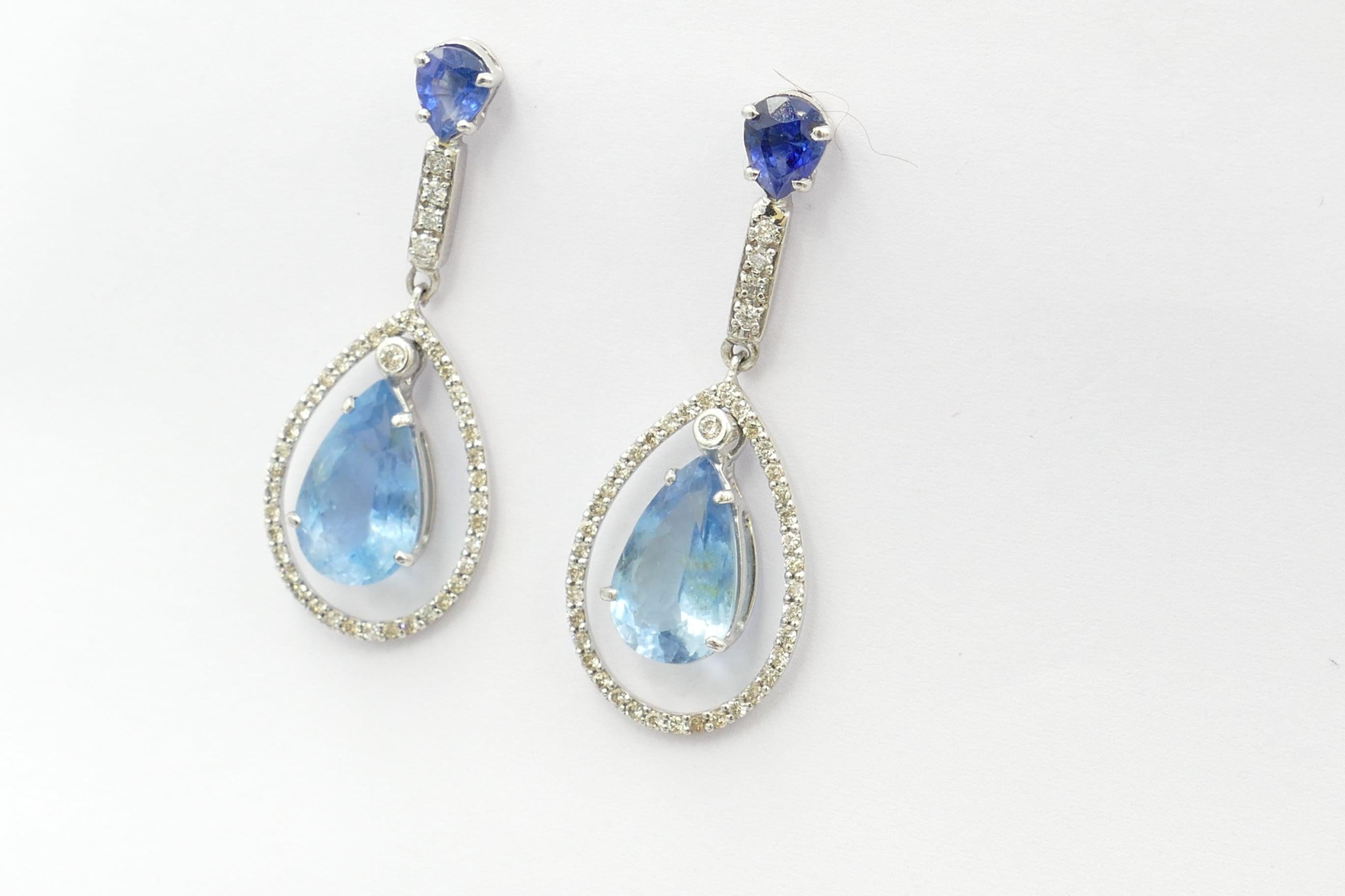 What a fabulously unusual combination of stones that really work!
2 High Quality, Pear Cut Aquamarines, mid blue in Colour, Tone medium, Clarity eye-clean, individually claw set are the dominant feature of these absolutely stunning Earrings. 
As