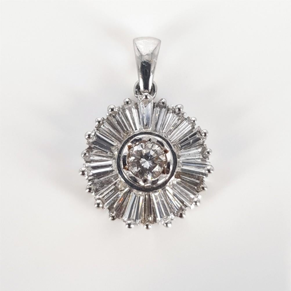 This Gorgeous 18ct White Gold Baguette Diamond Pendant is carefully set with 22 beautiful Baguette Cut Diamonds (GH vs-si) weighing 1.21carat in total and 1 RBC Diamond (LK vs-si) weighing 0.2ct. This Pendant is 11mm in diameter and weighs 2.8grams.