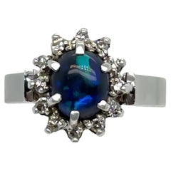 Anillo en racimo de ópalo negro y diamantes de oro blanco de 18 ct 0,62 ct 5,28 g