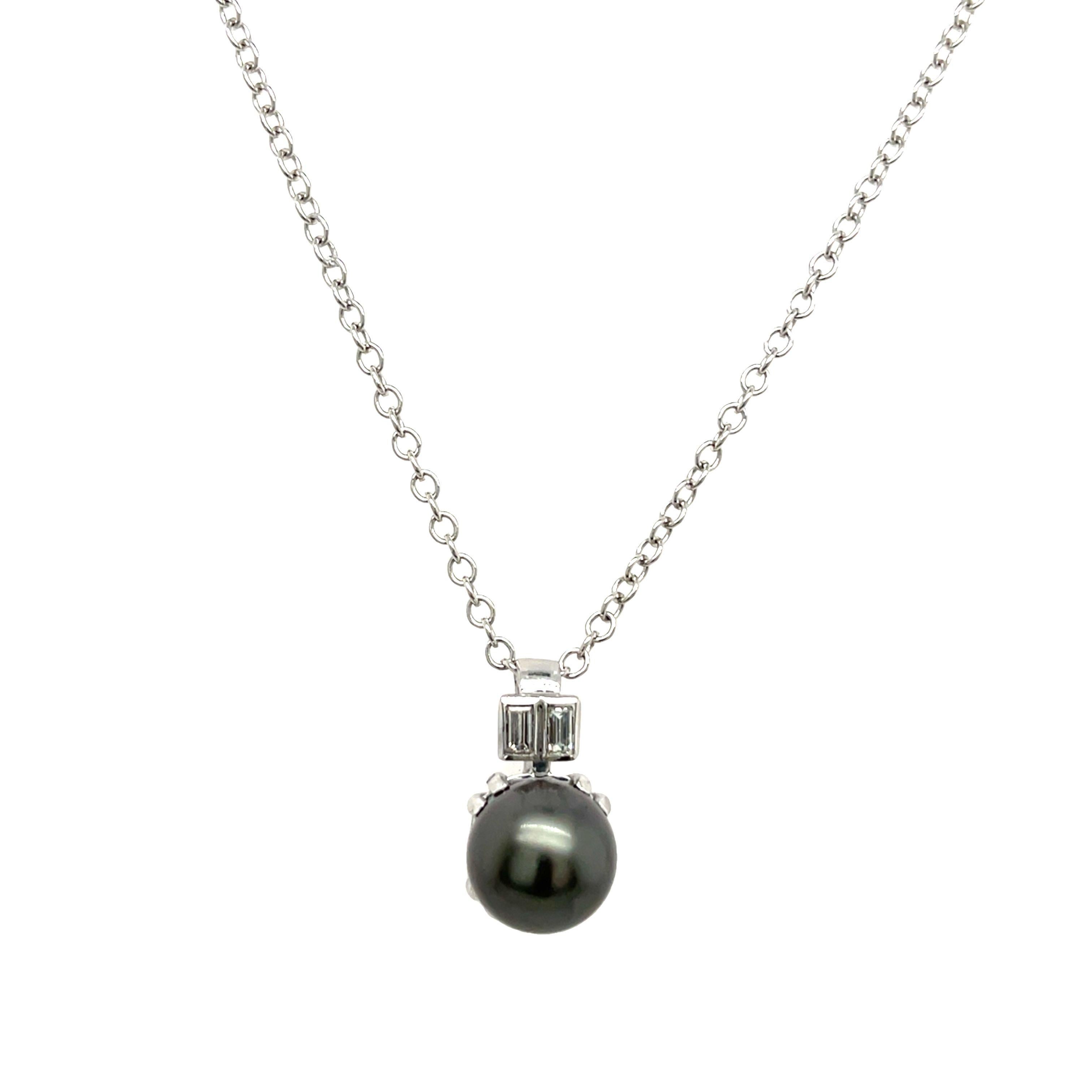 A stunning jewellery set featuring black pearls, 
including earrings and a pendant. 
The pearls are elegantly mounted in 18ct white gold, and 2 baguette diamonds showcasing their natural luster and beauty.  A classic and sophisticated choice for any