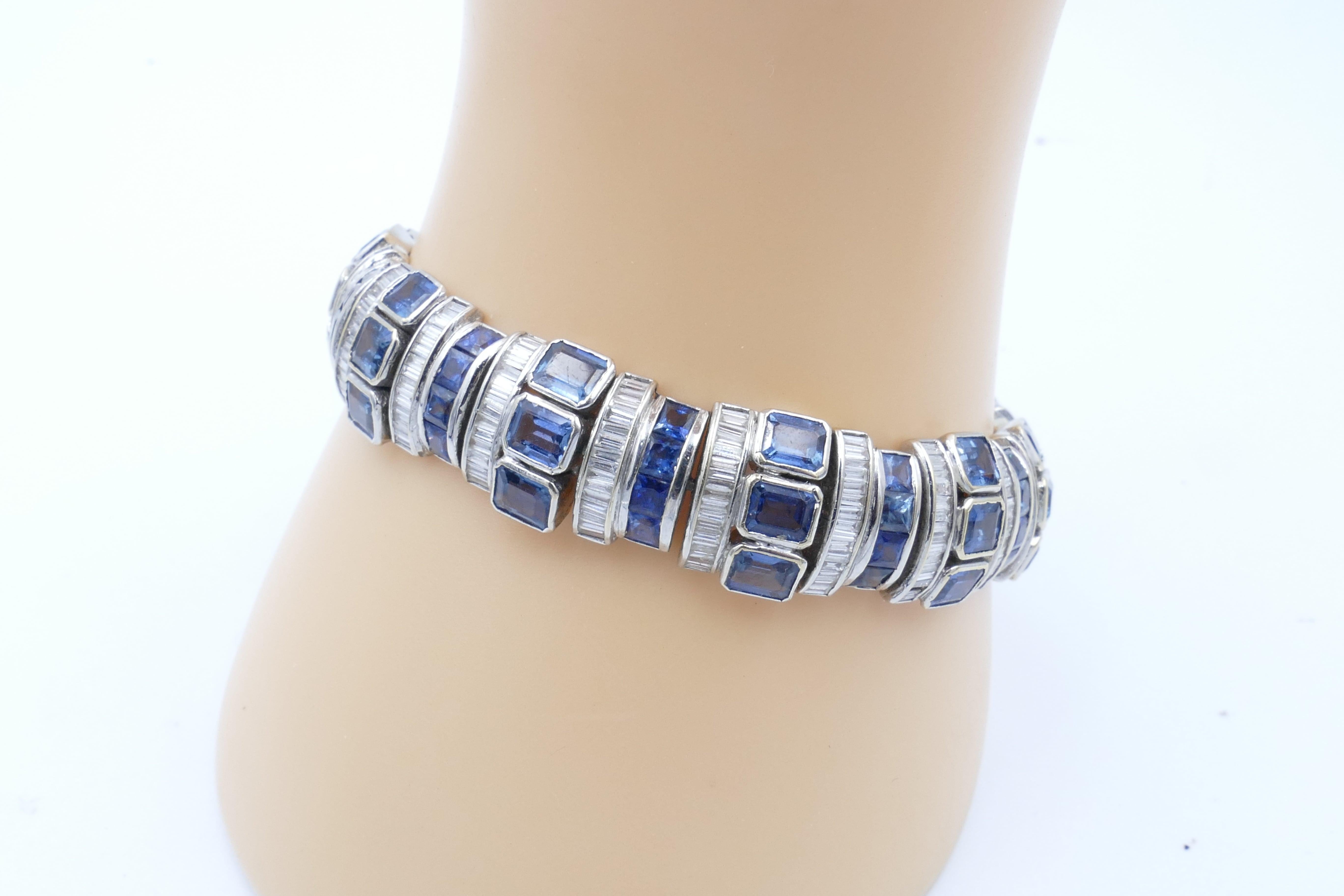This absolutely stunning hand made Sapphire Bracelet has 33 Emerald Cut Blue Sapphires bezel set with 44 Carre Cut Blue Sapphires Channel Set along with 348 Baguette Cut Diamonds of very high quality Colour being F-G.
The Bracelet measures 18.5cm in