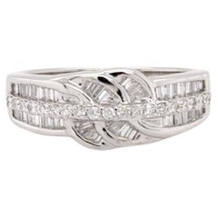 Anello decorativo con diamante Brilliante e Baguette in oro bianco 18 ct.
