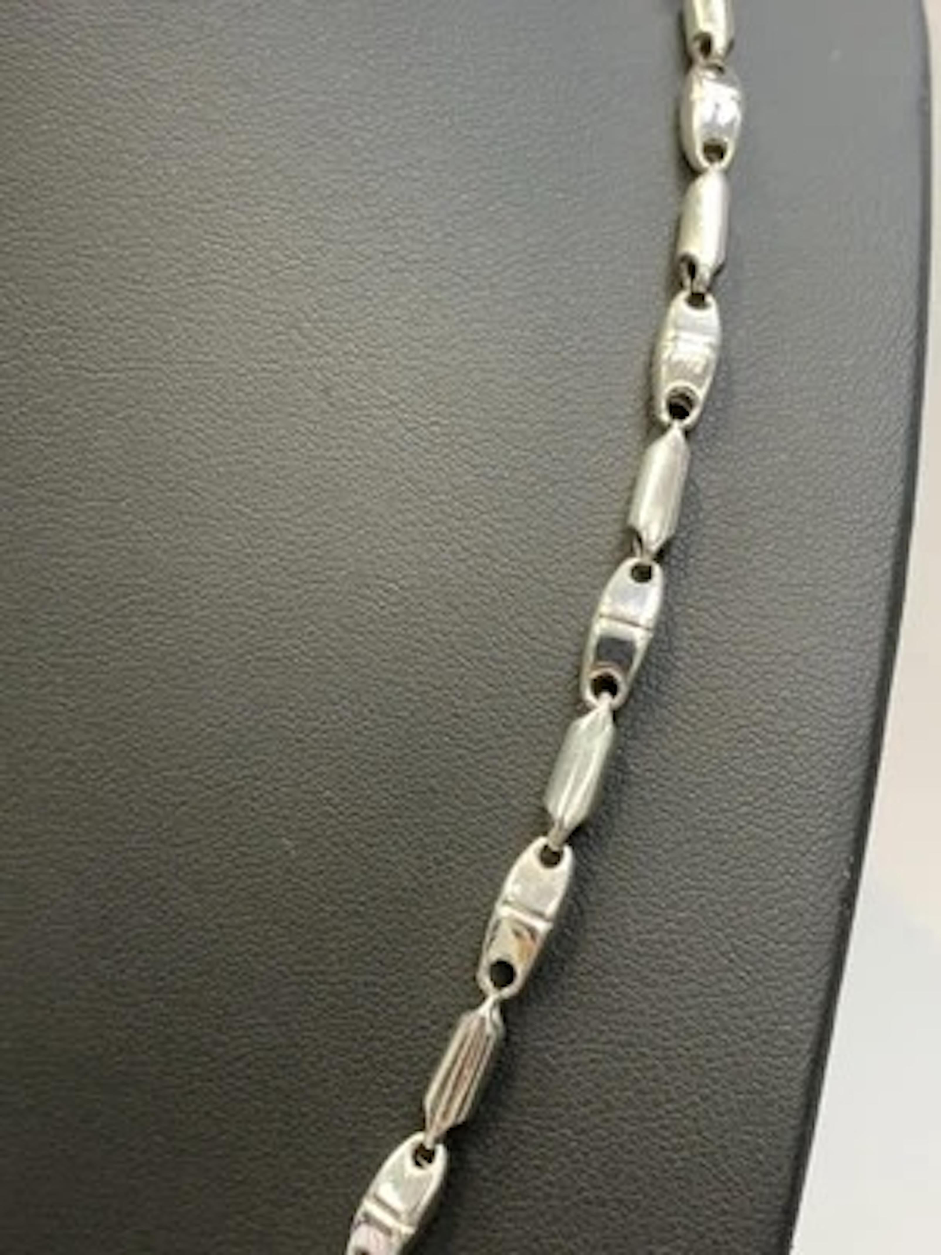 This is an Italian 18ct white gold chunky chain necklace measuring 24 inches and weighing 18.8g. The necklace does not feature a main stone and is designed in a stylish chain style. The metal purity is of high quality, making it a luxurious and