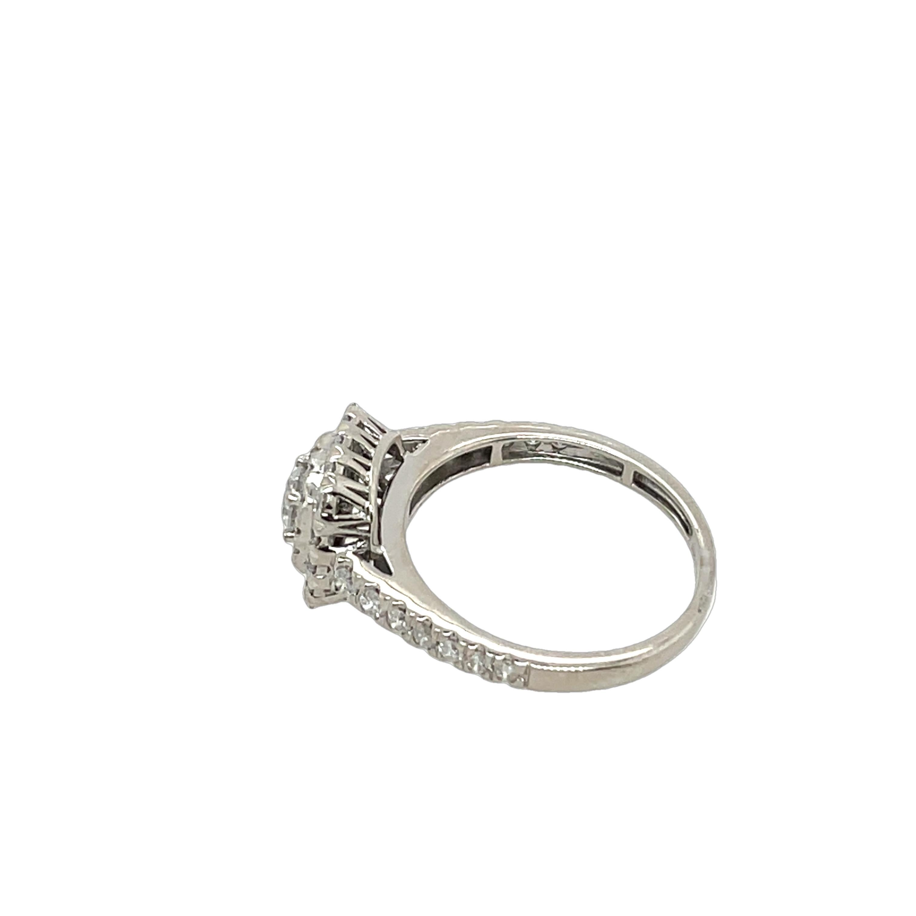 This stunning diamond cluster ring, crafted in solid 18ct white gold, is set with 0.80ct of sparkling round-cut natural diamonds, the cluster setting creates a dazzling effect, making this ring a perfect choice for special occasions or as an elegant