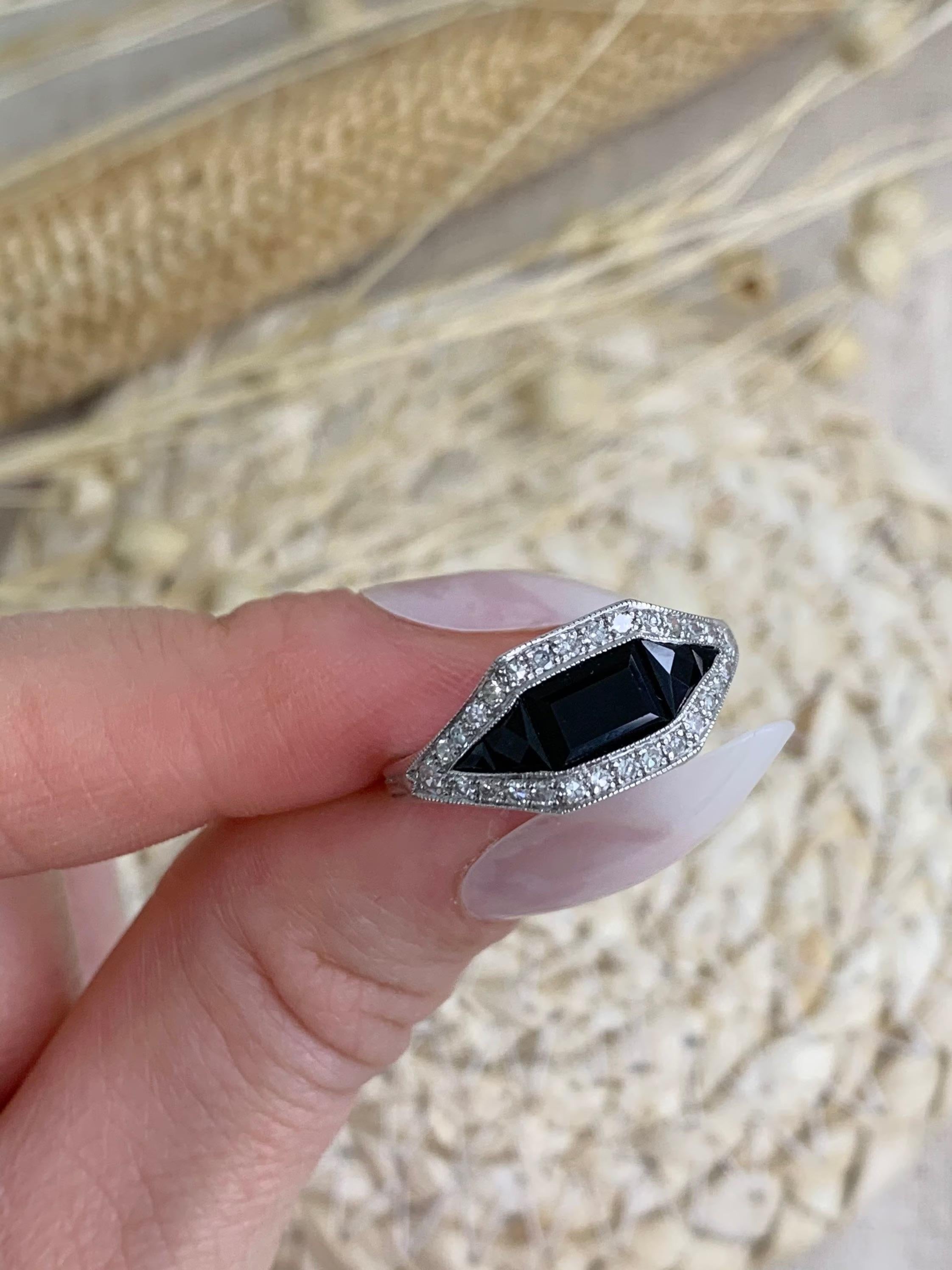 Art Deco Style Onyx & Diamond Ring

18ct White Gold 

Set with beautiful Onyx, surrounded by fabulous diamonds. 

Circa 1990’s

UK Size N 1/2 

US Size 7

Can be resized using our £25 resizing service, please contact us for more information

All of