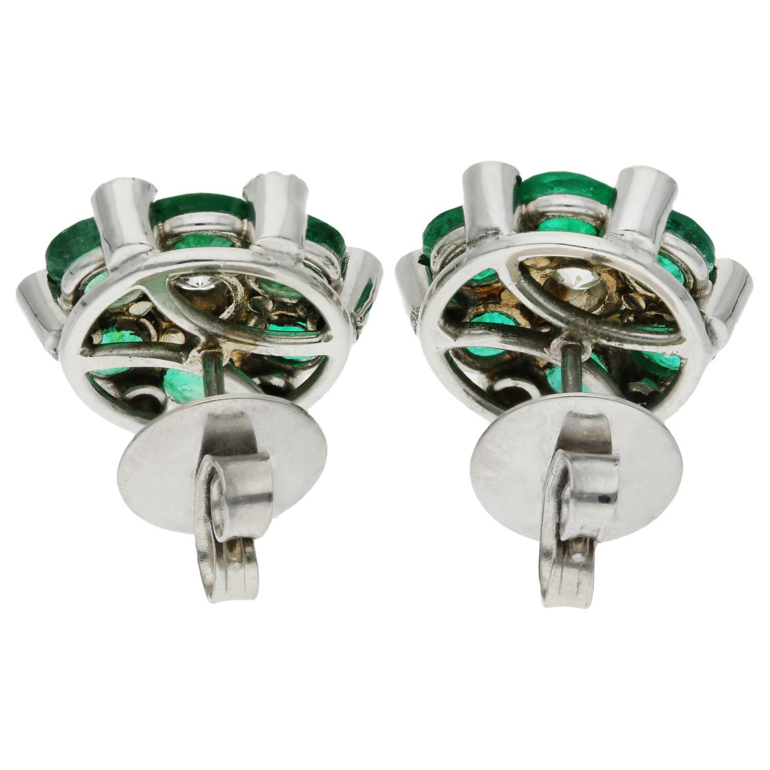 18ct White Gold Diamond & 2.40ct Emerald Earrings

Elevate your style with these exquisite pre-owned 18ct White Gold Diamond & Emerald Earrings, hallmarked in London, 2013. Each earring features a mesmerising floral cluster design, boasting six
