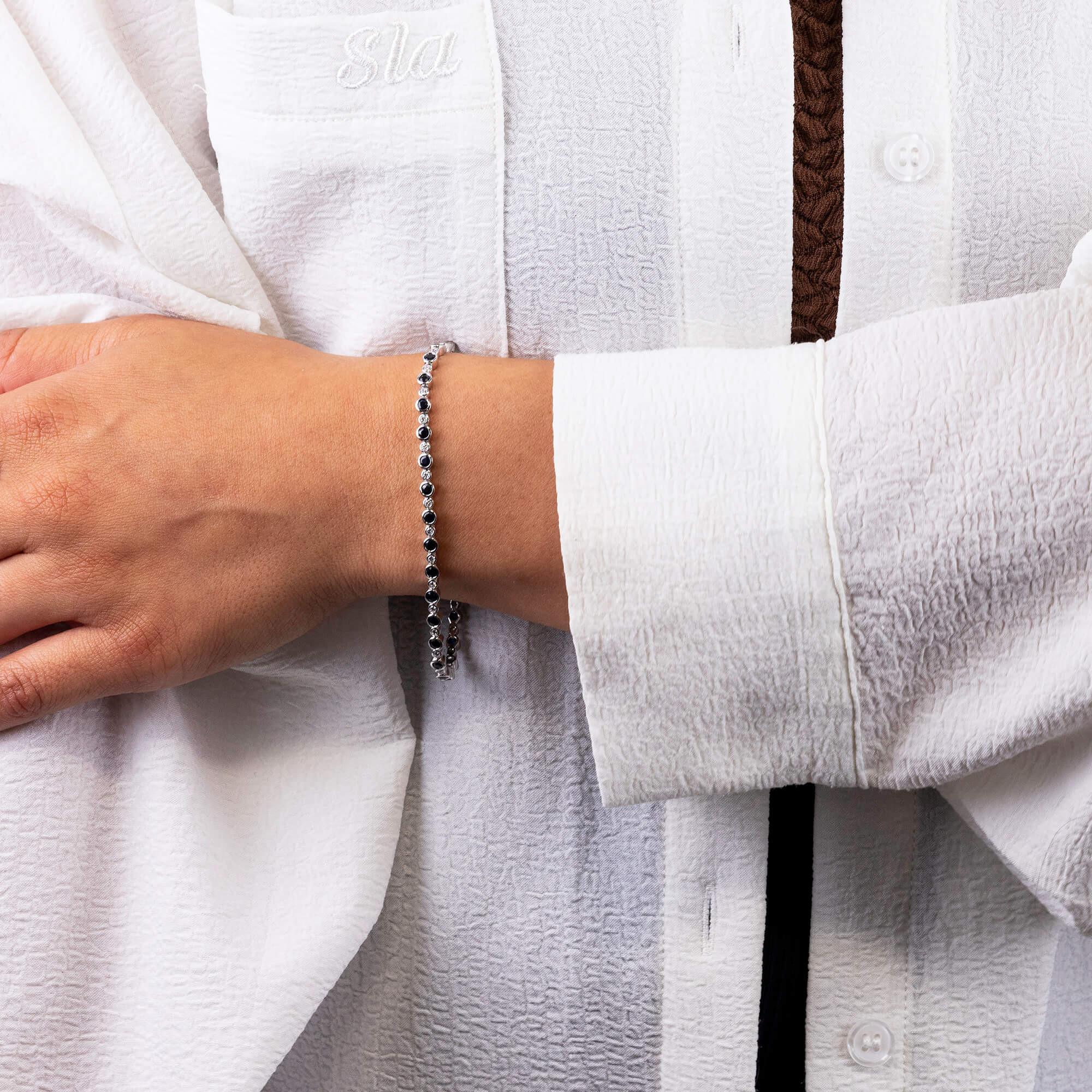18ct White Gold Diamond & 3.50ct Sapphire Tennis Bracelet

Elevate your elegance with our 18ct white gold tennis bracelet, featuring a stunning composition of 3.50 carats of round sapphires, each securely held in a bezel setting. Between each