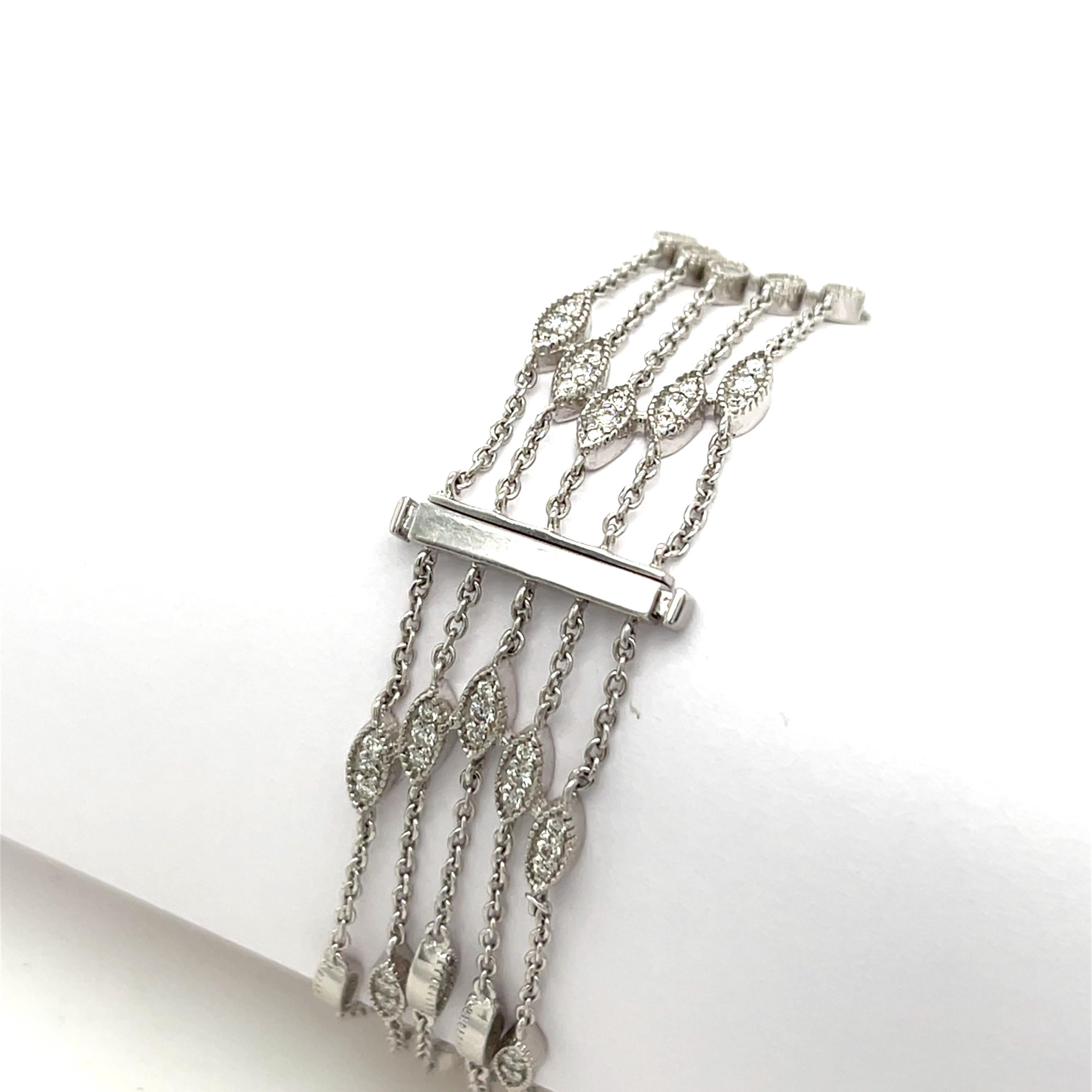 This exquisite 18ct white gold bracelet features a dazzling arrangement of 1.40ct natural round diamonds across five rows, offering a rich, layered sparkle. 

Total weight: 18.12g
Total Diamond Weight: 1.40ct
Diamond Colour: G
Diamond Purity: