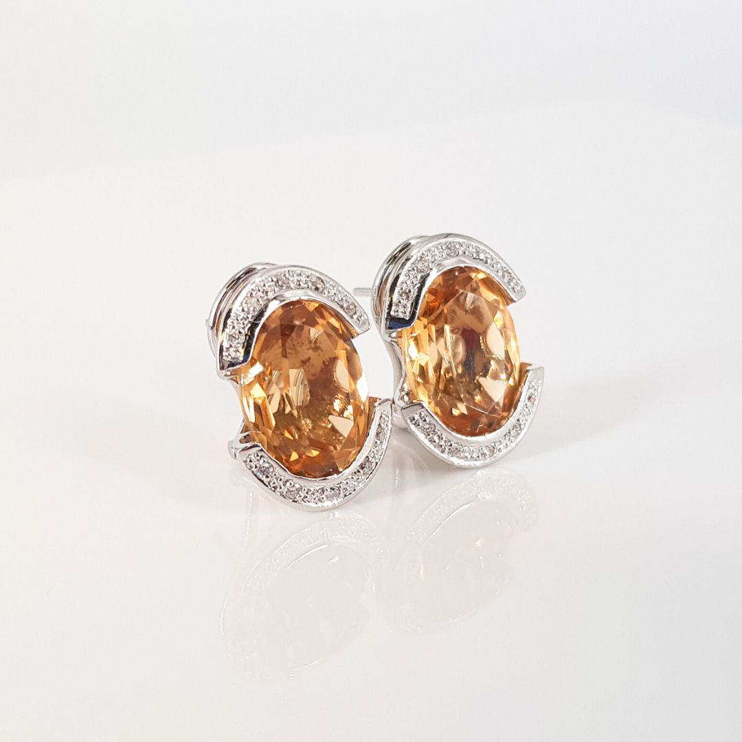 Stunning
Item Attributes
Weight:			9.1 gram
Metal Colour: 		White Gold
Metal:		               18ct
Stone Attributes
Number of Stones:	  2 x Citrine
Carat:                                   2 x est 6ct
Cut:                                     Oval