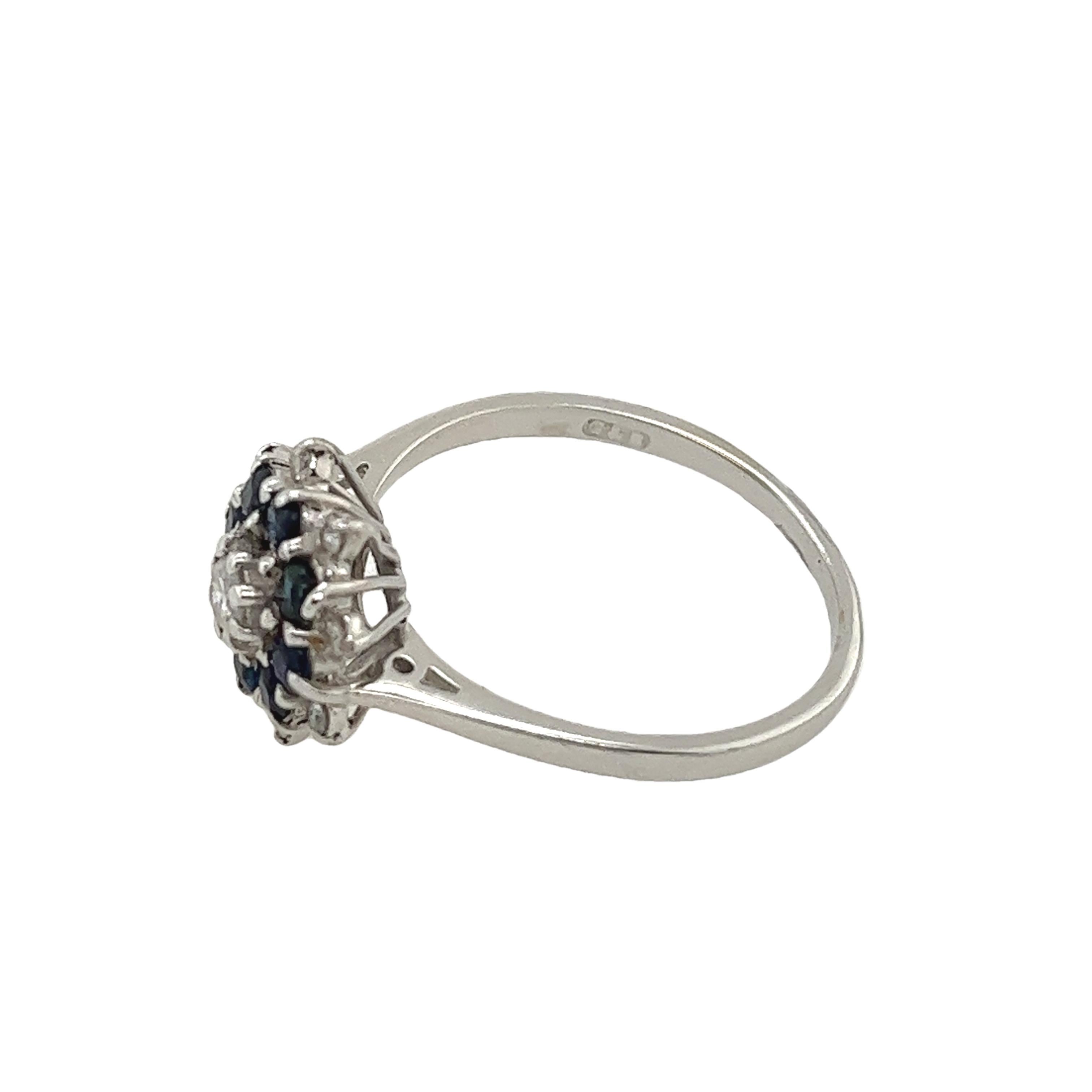 This 18ct white gold diamond and sapphire cluster ring
is set with a stunning arrangement of vibrant sapphires 
and sparkling diamonds.
Perfect for engagements, and anniversaries.
Total Diamond Weight: 0.27ct
Diamond Colour: H
Diamond Clarity: