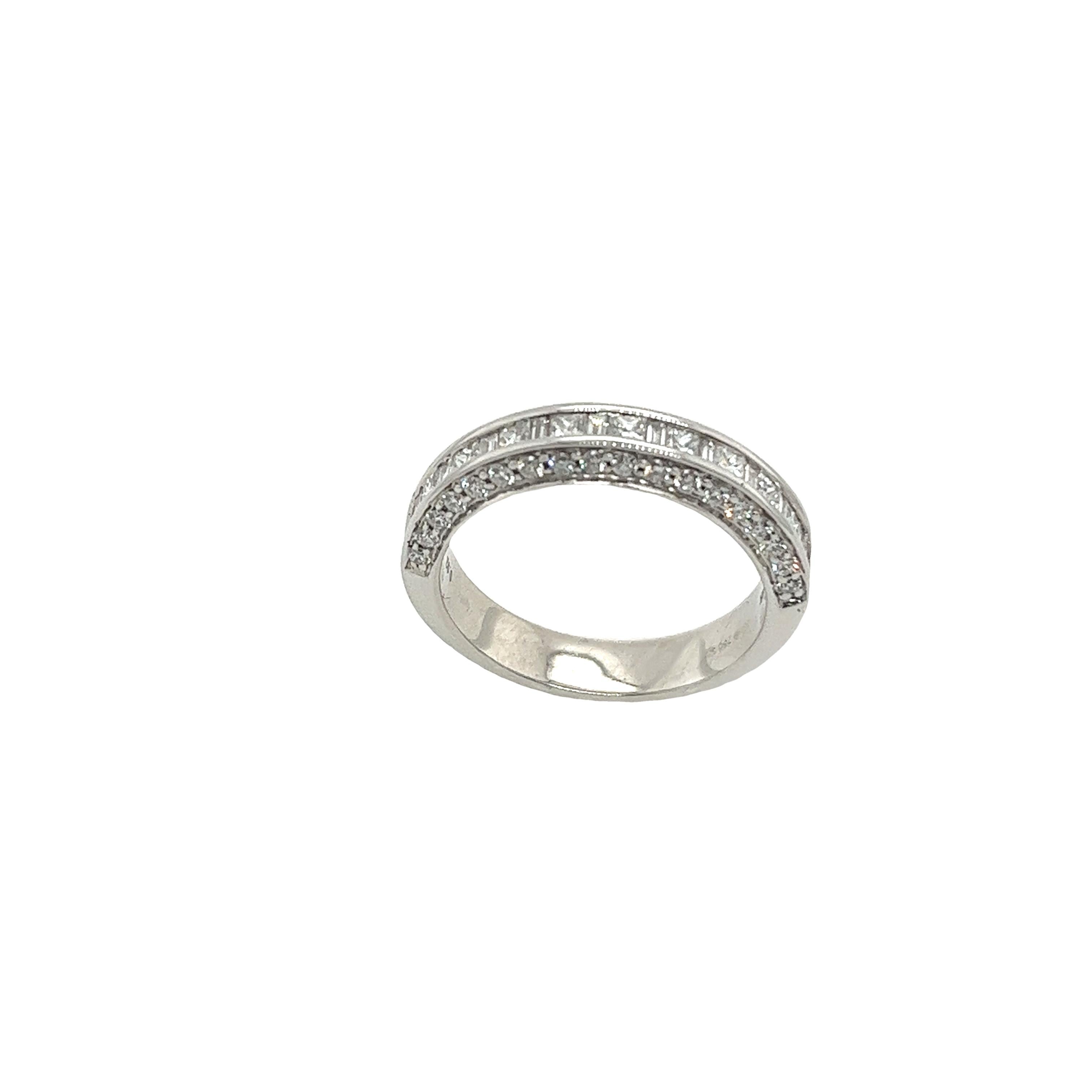 This 18ct white gold diamond half-eternity band 
is set with princess cut, baguette and round brilliant cut diamonds
0.90ct of natural diamonds.
This ring is elegant and beautiful for a wedding or an aniversary ring.
Total Diamond Weight: 0.90ct